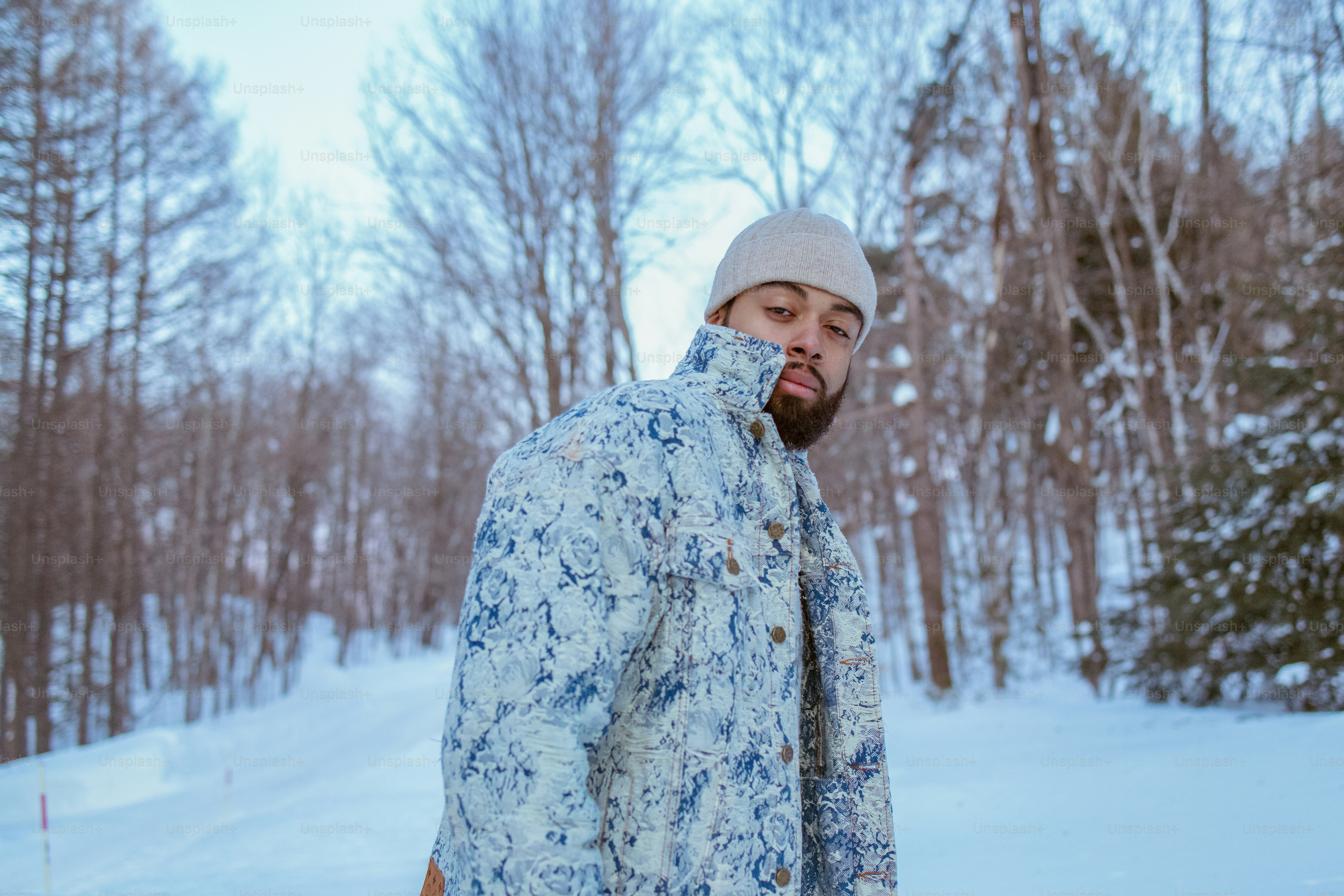 A man poses in the snow.