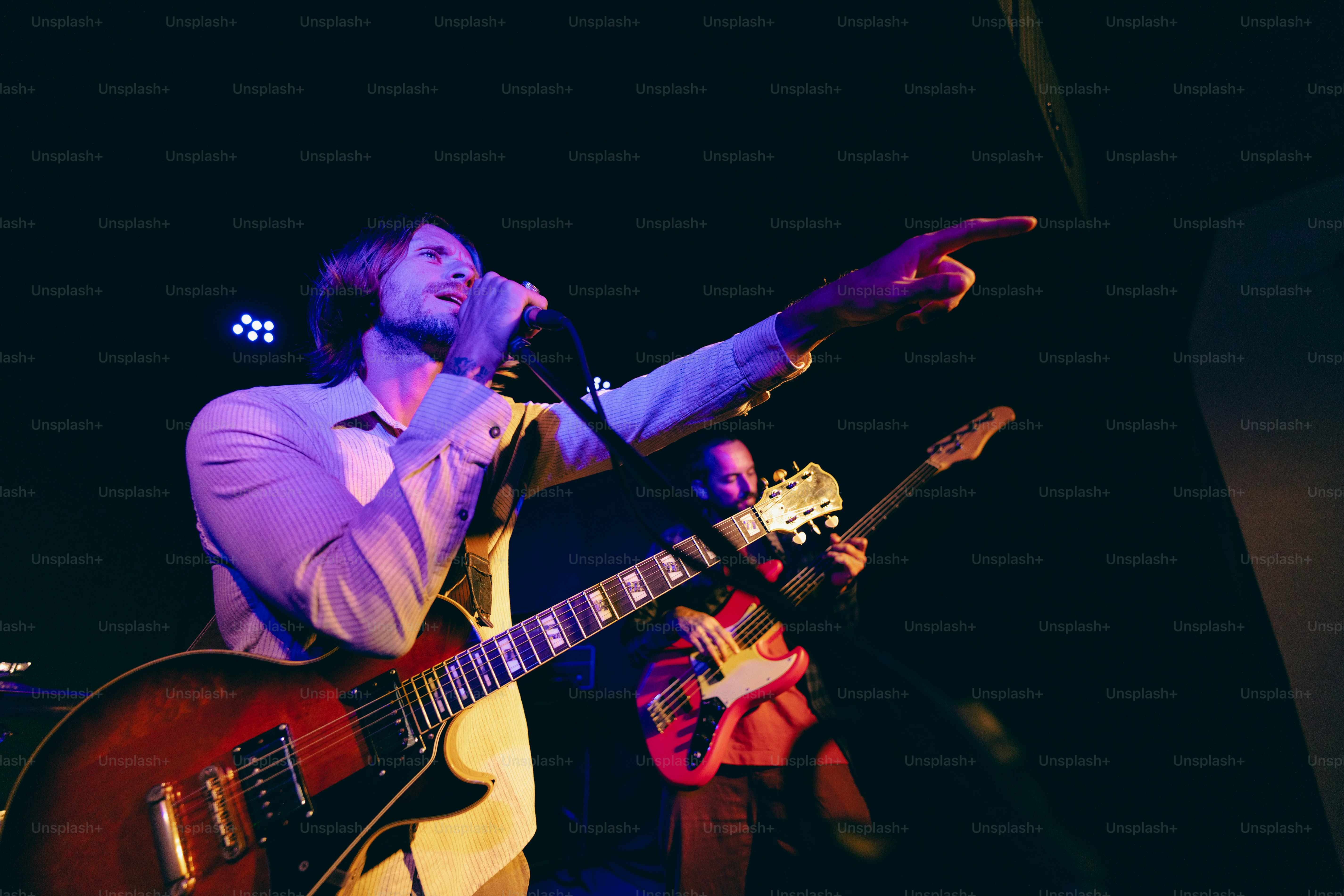 A singer performs passionately with microphone. photo – Man Image on ...
