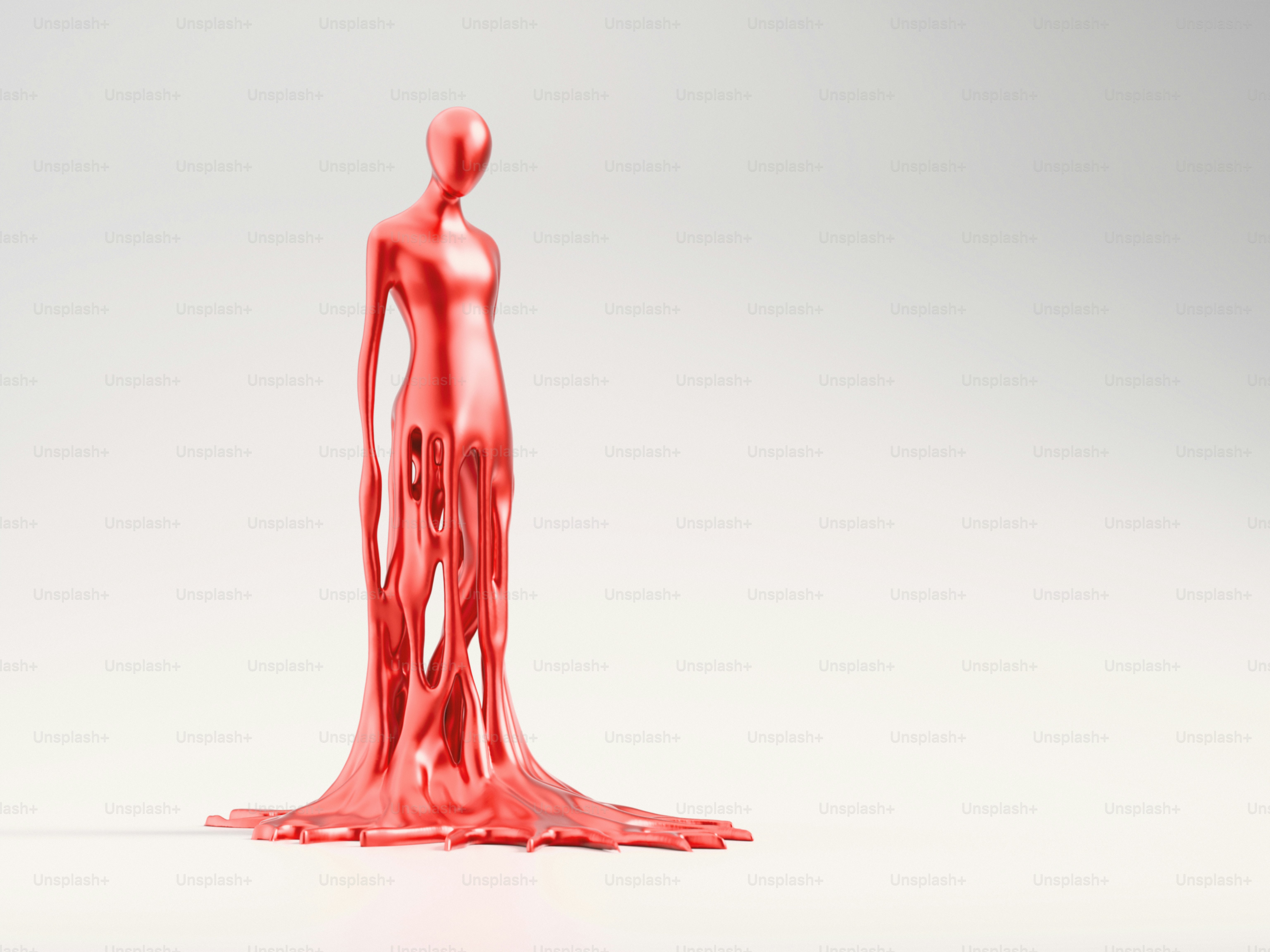A red sculpture of a figure is flowing. photo – Abstract Image on Unsplash