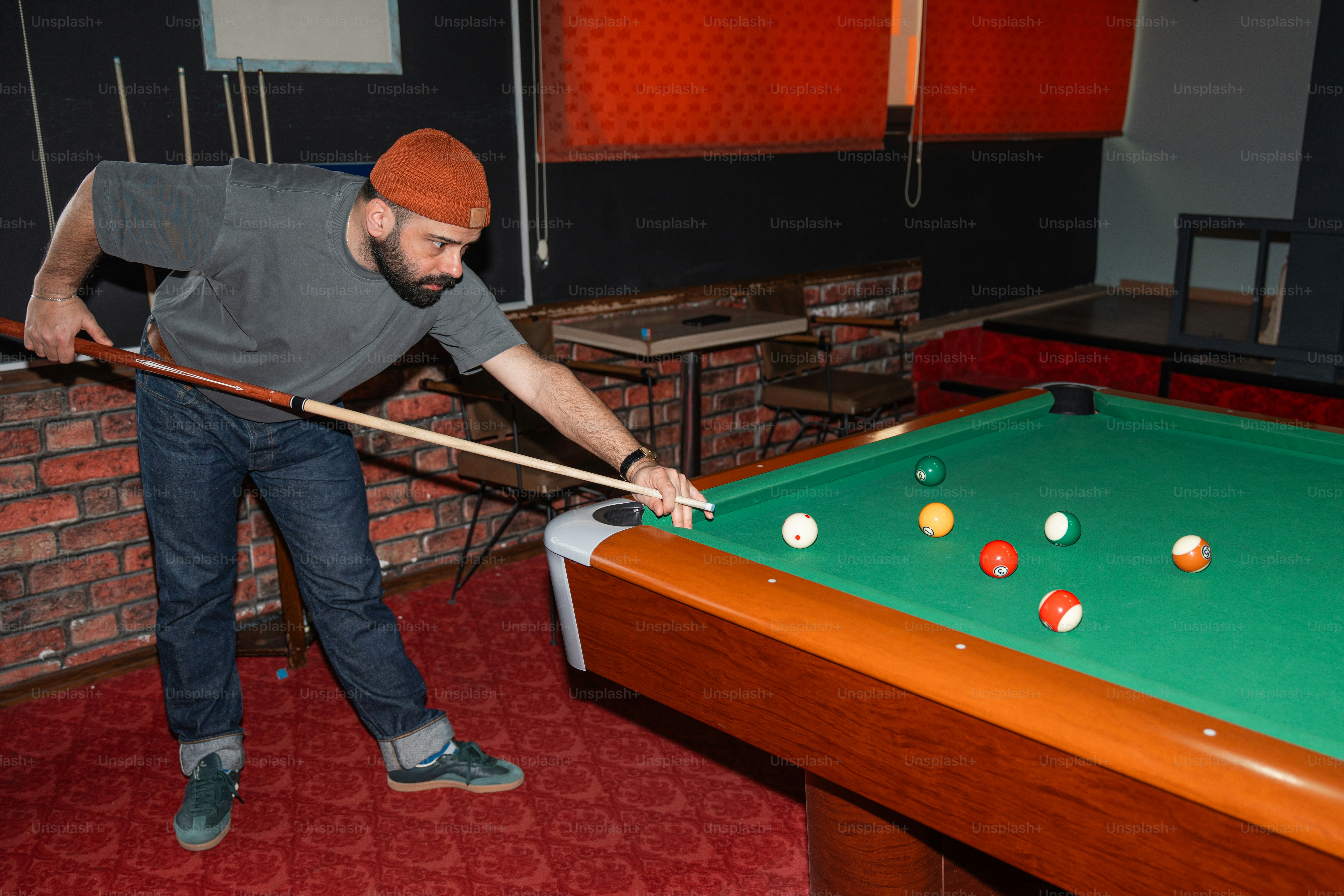 Someone is racking the pool balls. photo – Friends Image on Unsplash