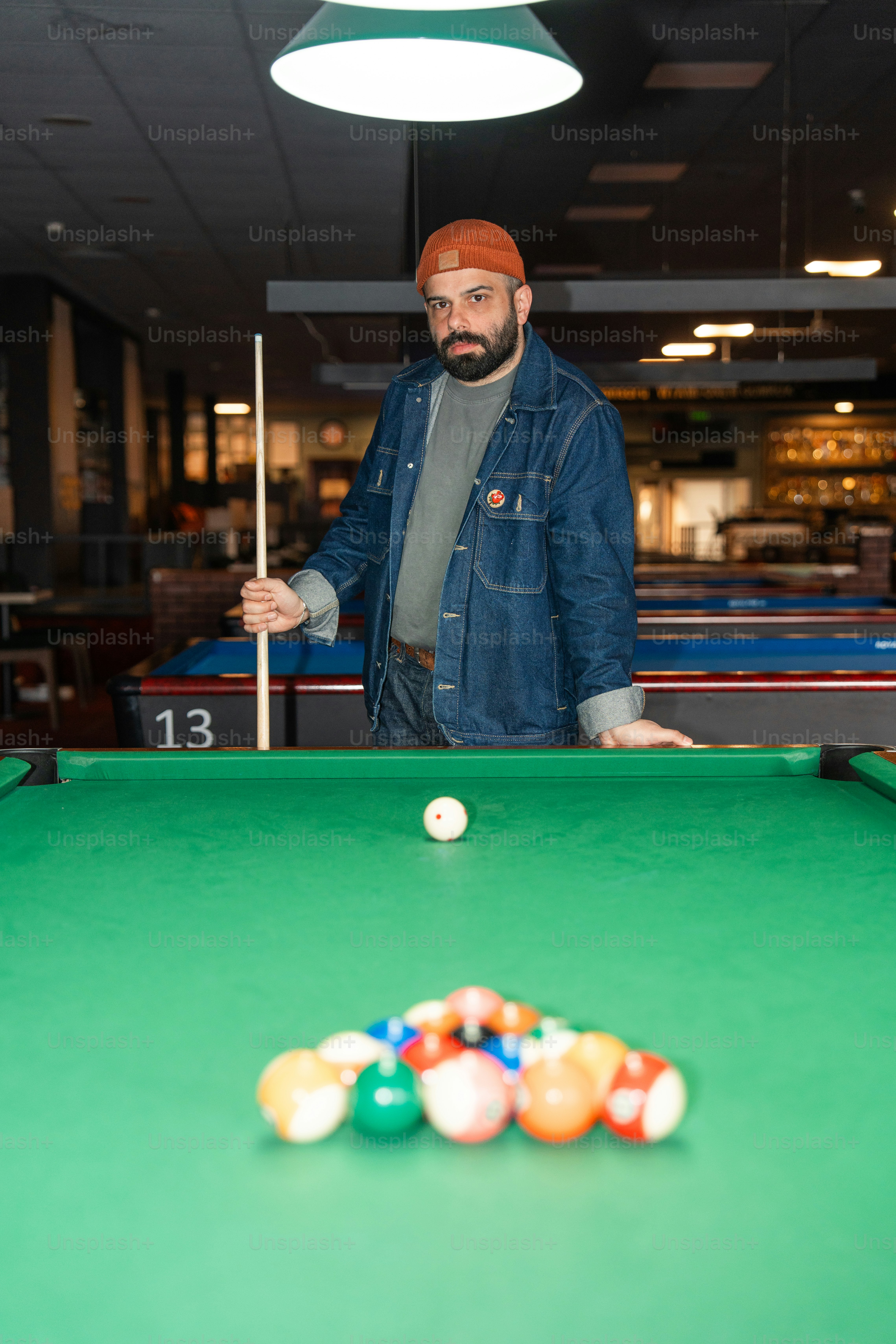 Someone is racking the pool balls. photo – Friends Image on Unsplash