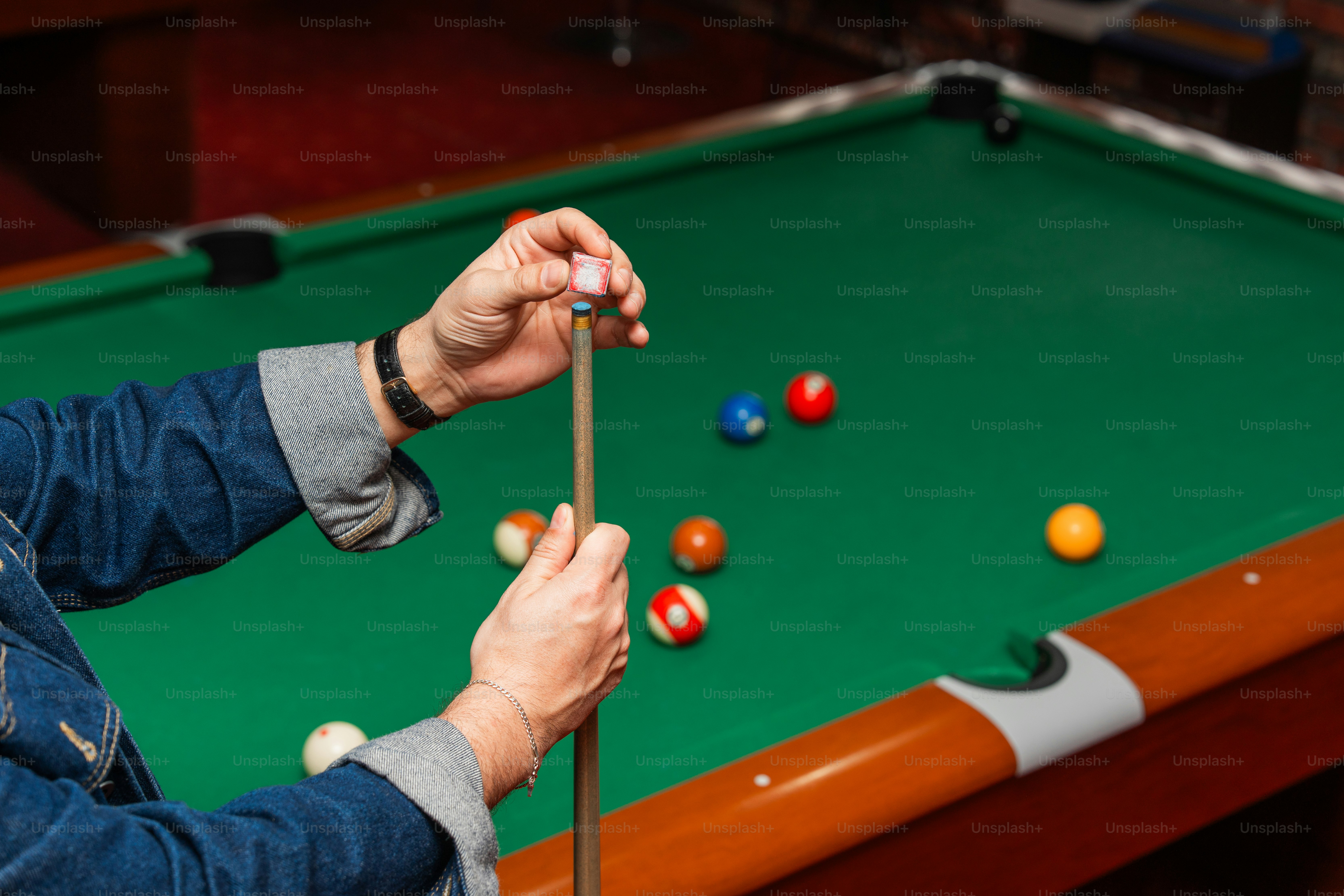 Someone is preparing to play a game of pool.