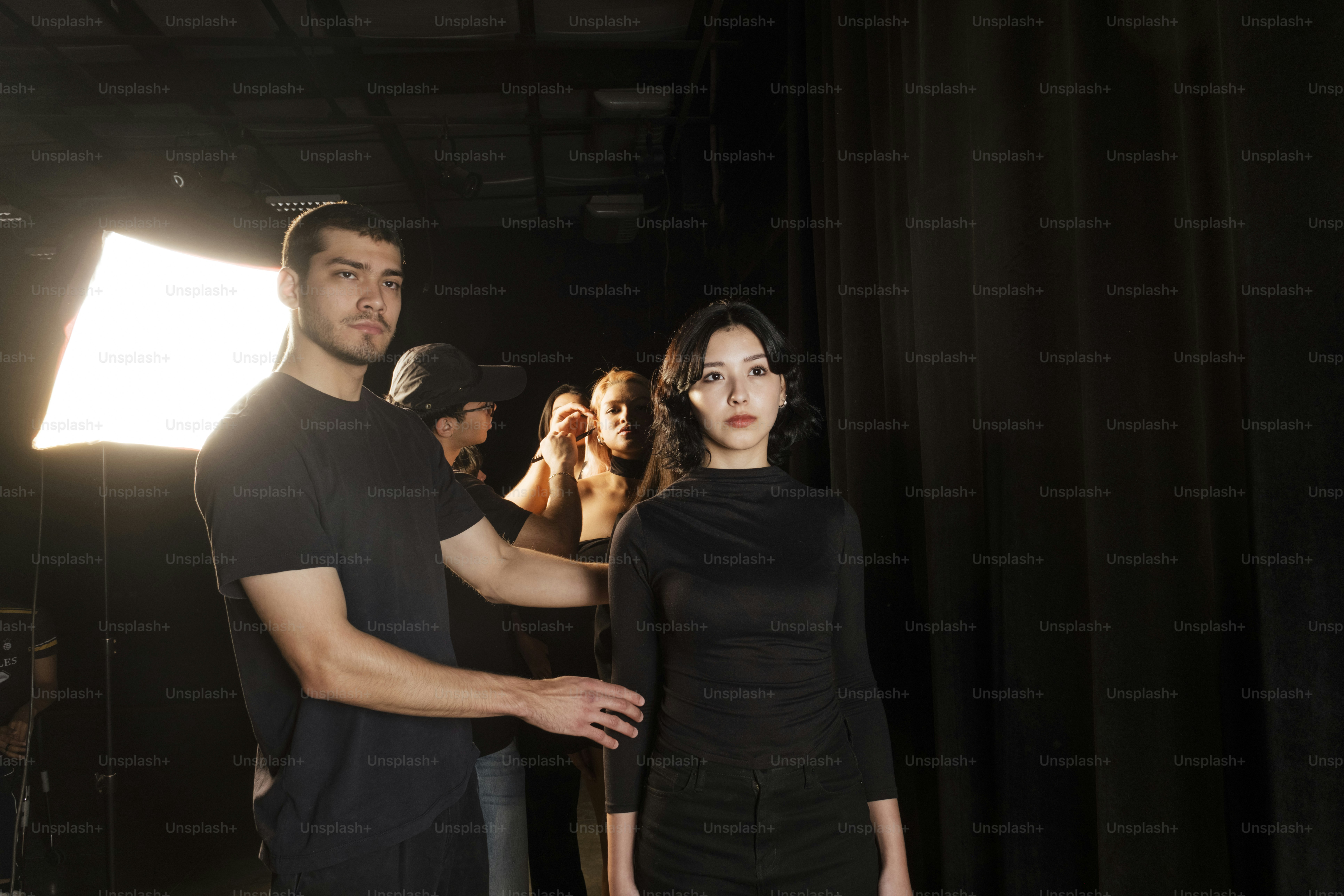 A photoshoot is in progress with a model.