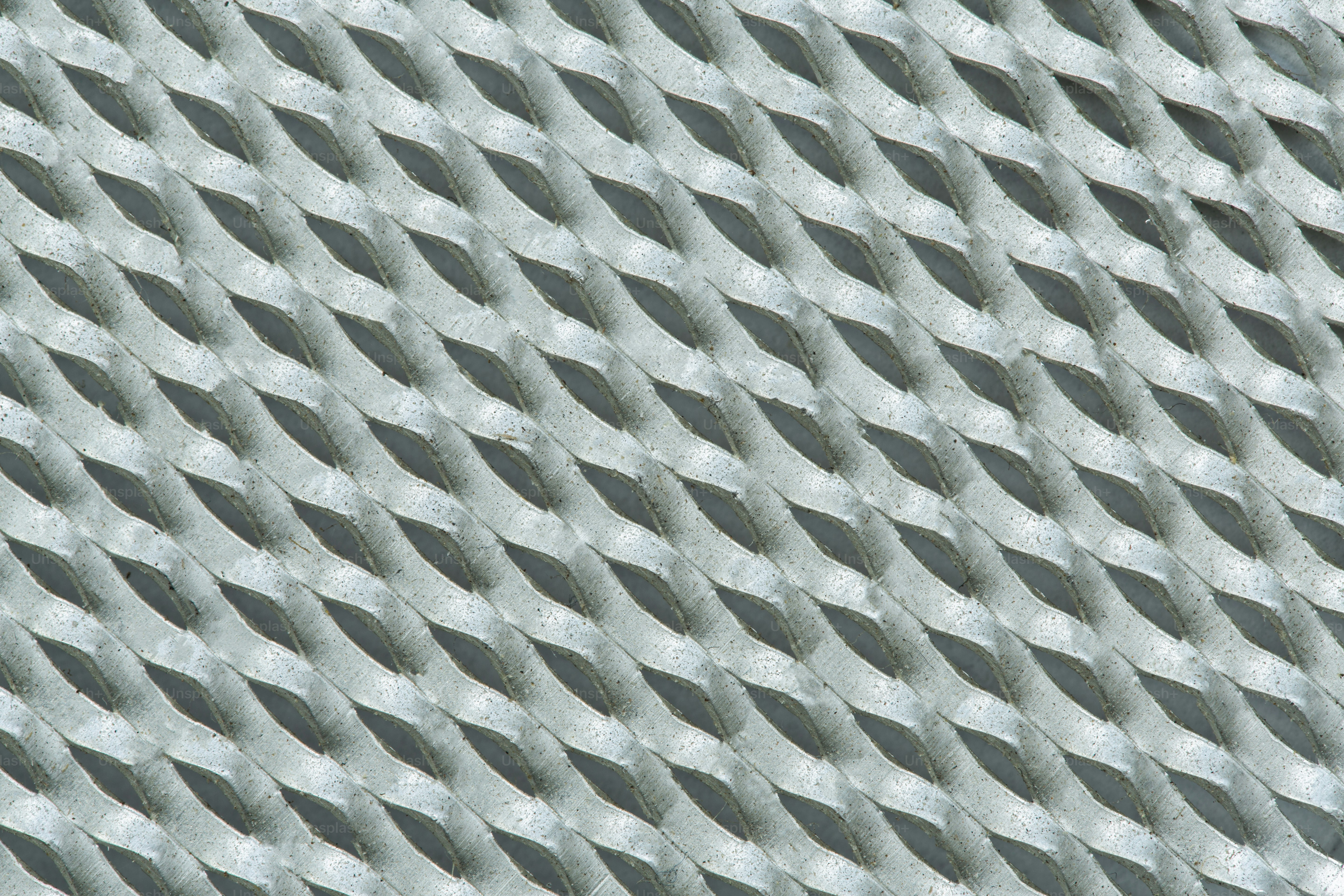 A close-up view of a metal grid pattern.