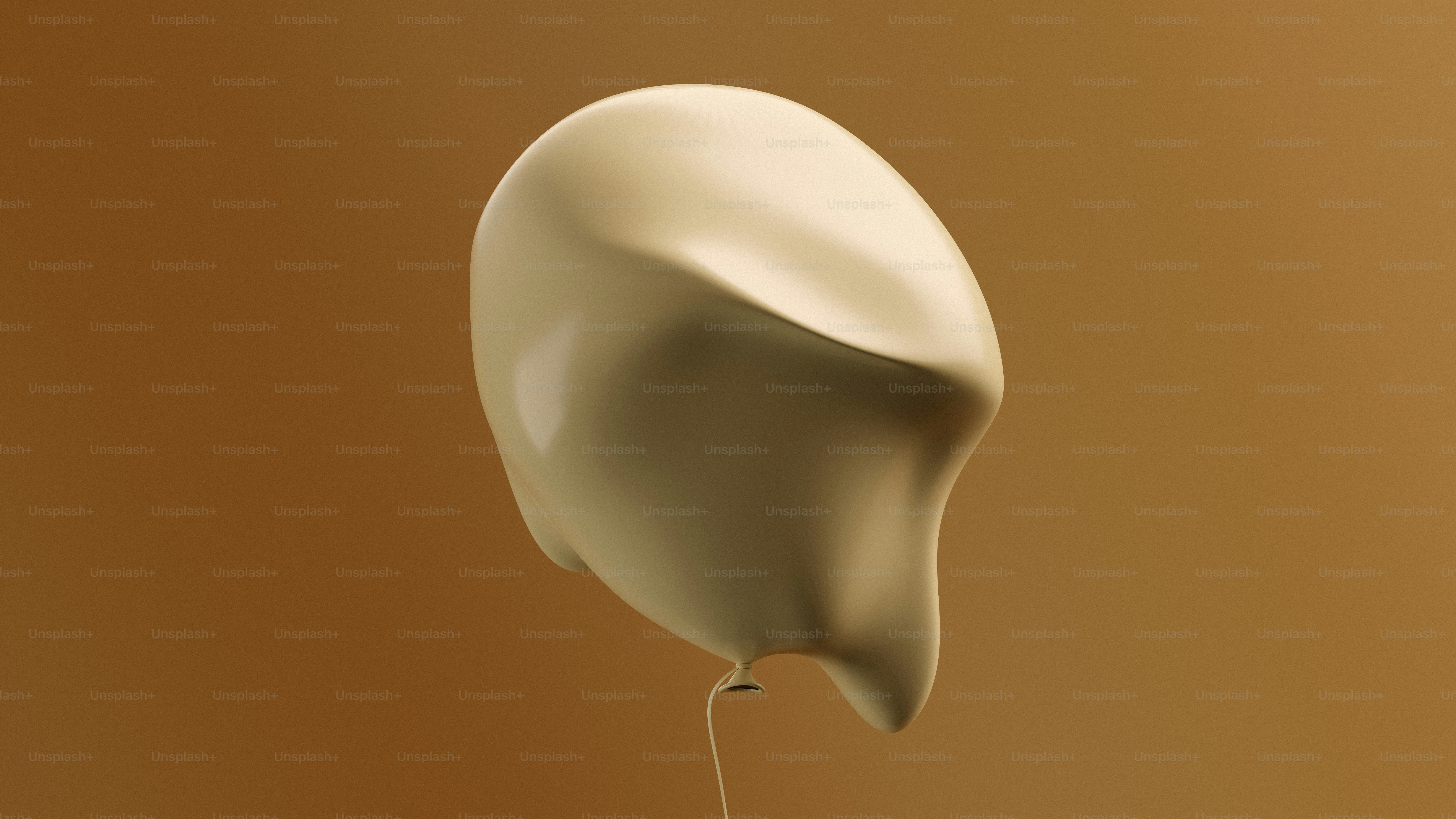 A beige balloon floats against a brown background.