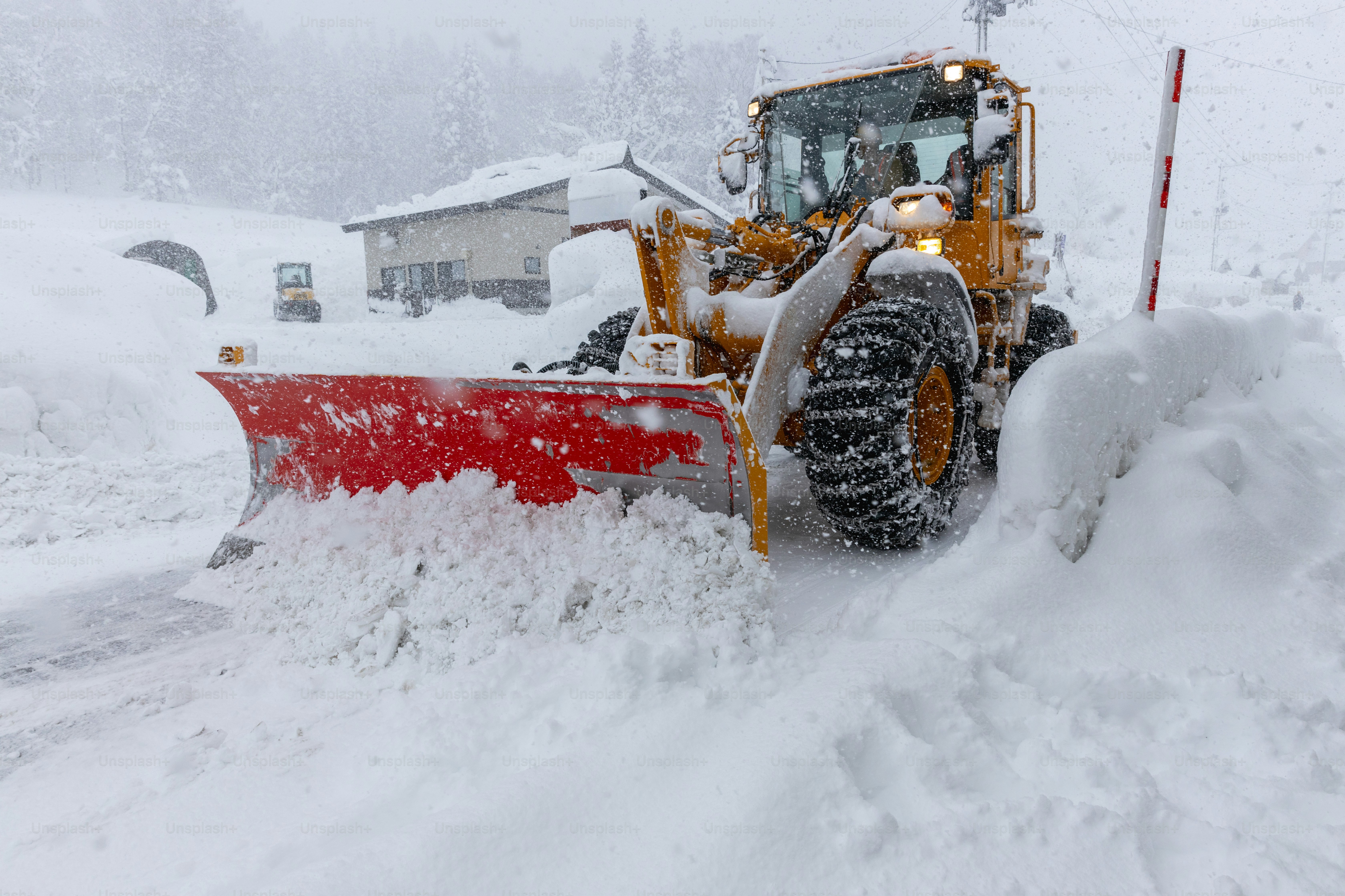 A snowplow clearing the snow from roads. Yamagata, Japan.
