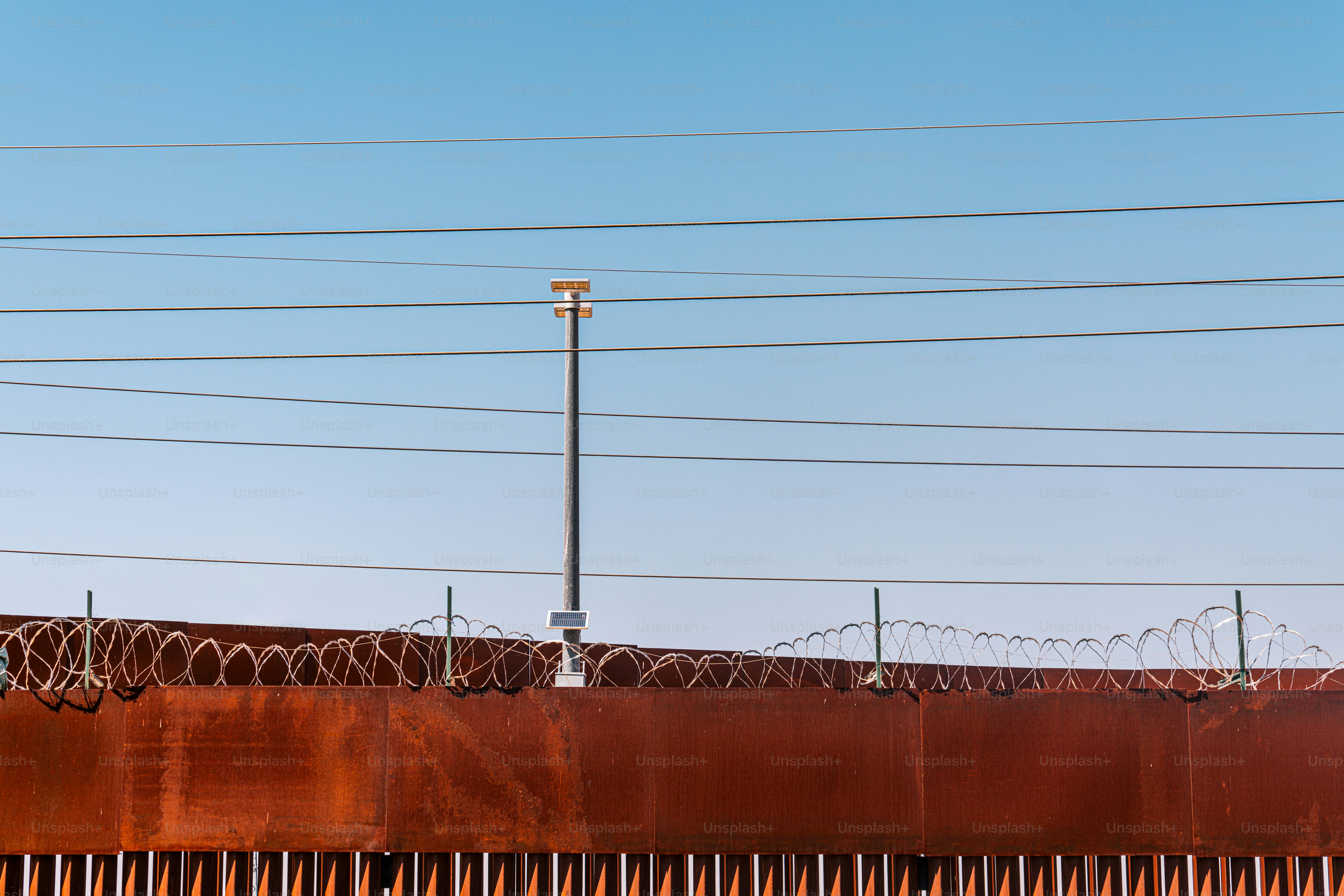 U.S. Southern Border Wall Fence separating San Luis Río Colorado, Sonora, Mexico in Summertime. Photo taken in Mexico