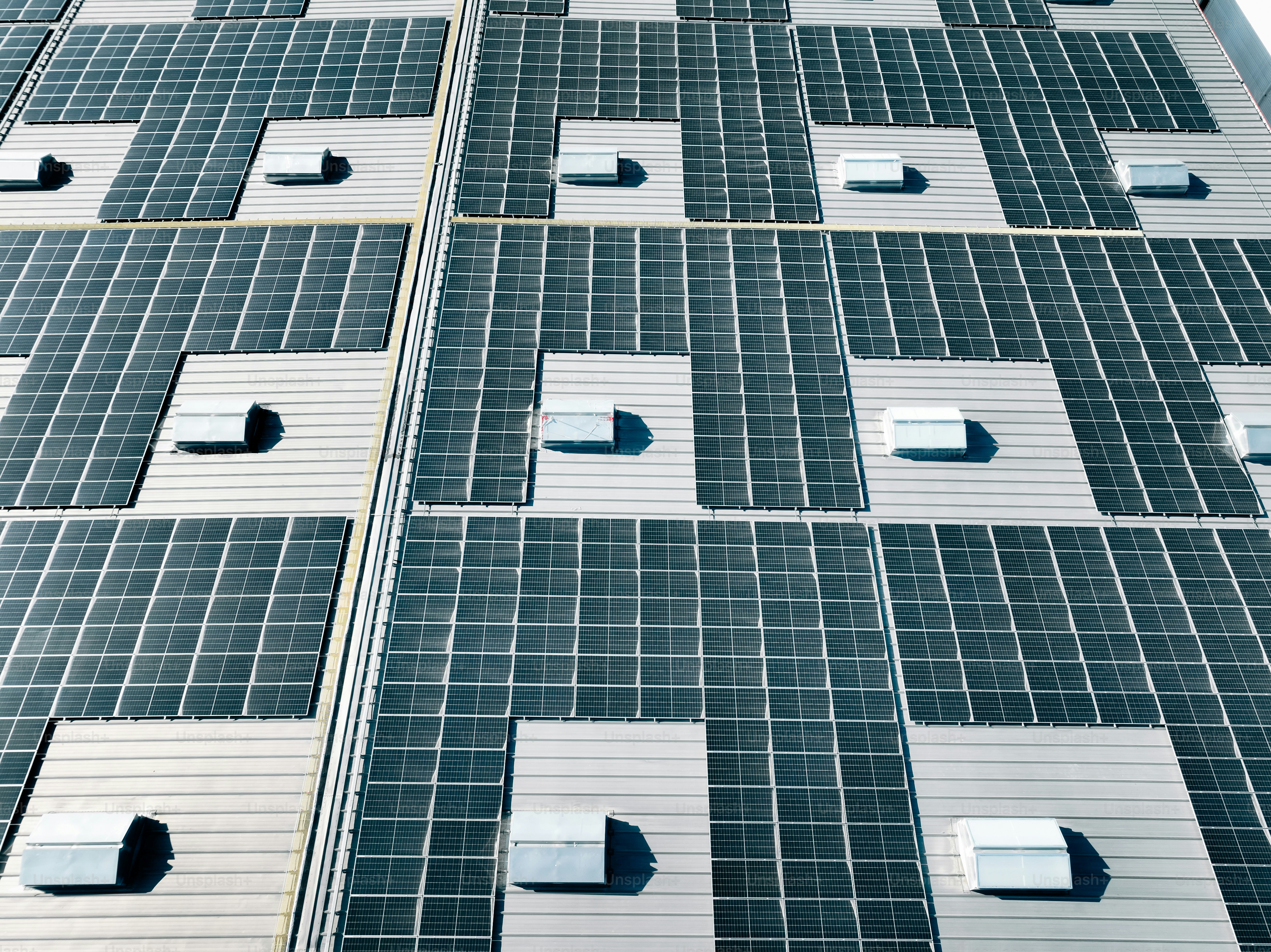 Aerial view of a factory with rooftop solar power