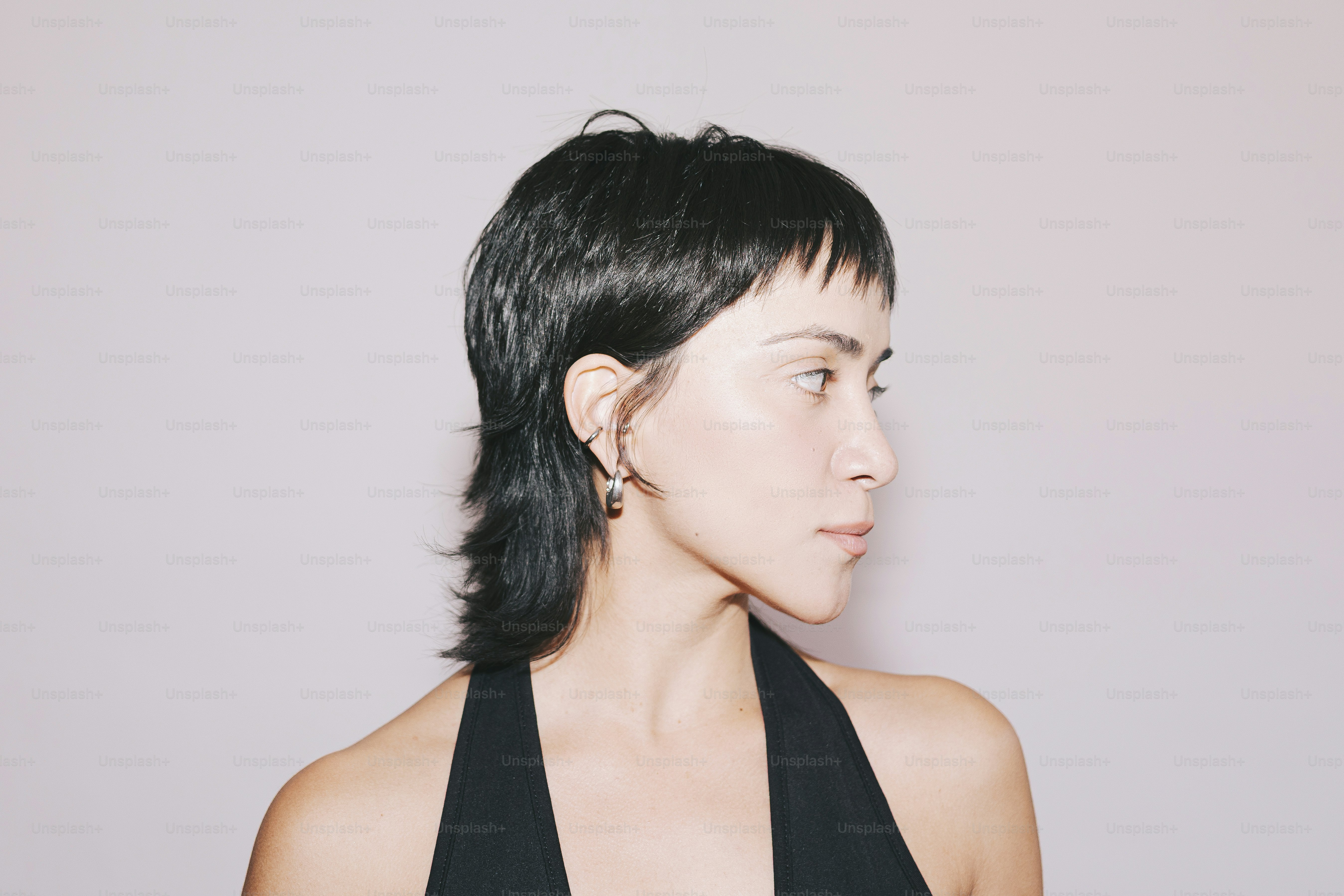 Woman poses with a cool mullet hairstyle.