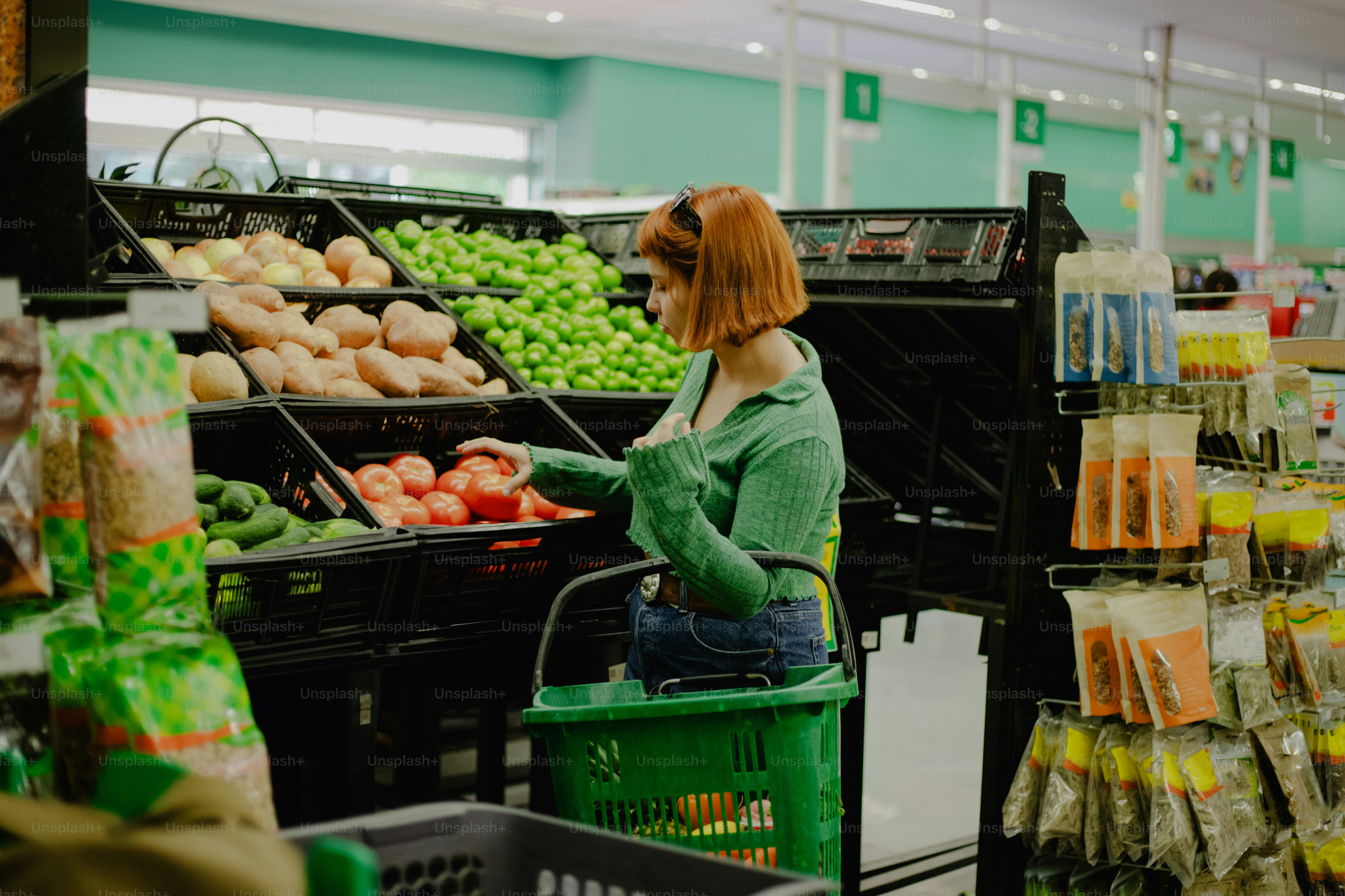 Woman is shopping for vegetables at the grocery store.
