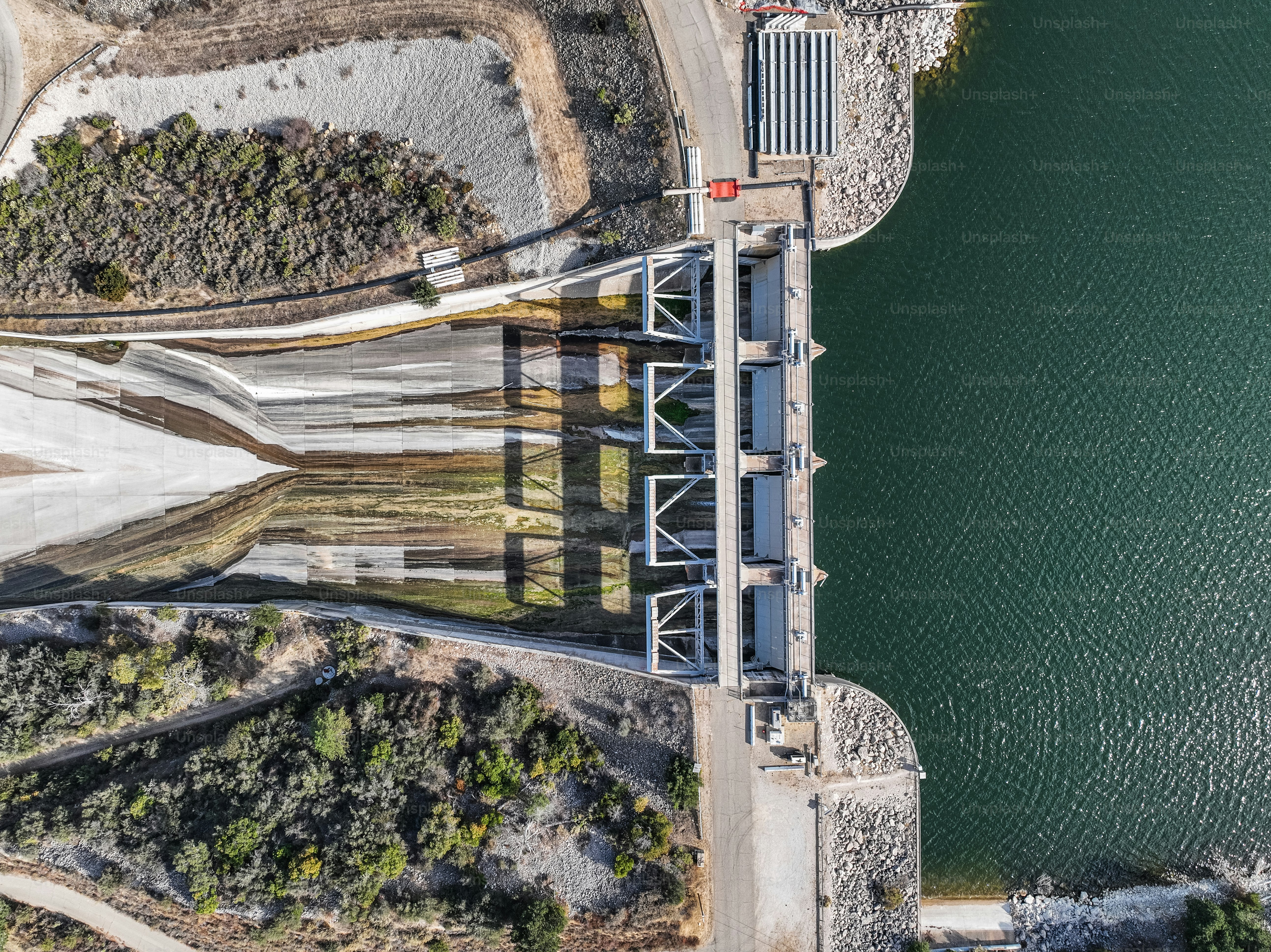 Aerial photo of Bradbury Dam, which forms Lake Cachuma. Photo shows the dam and includes the spillway in November 2023 when water levels in California are high.