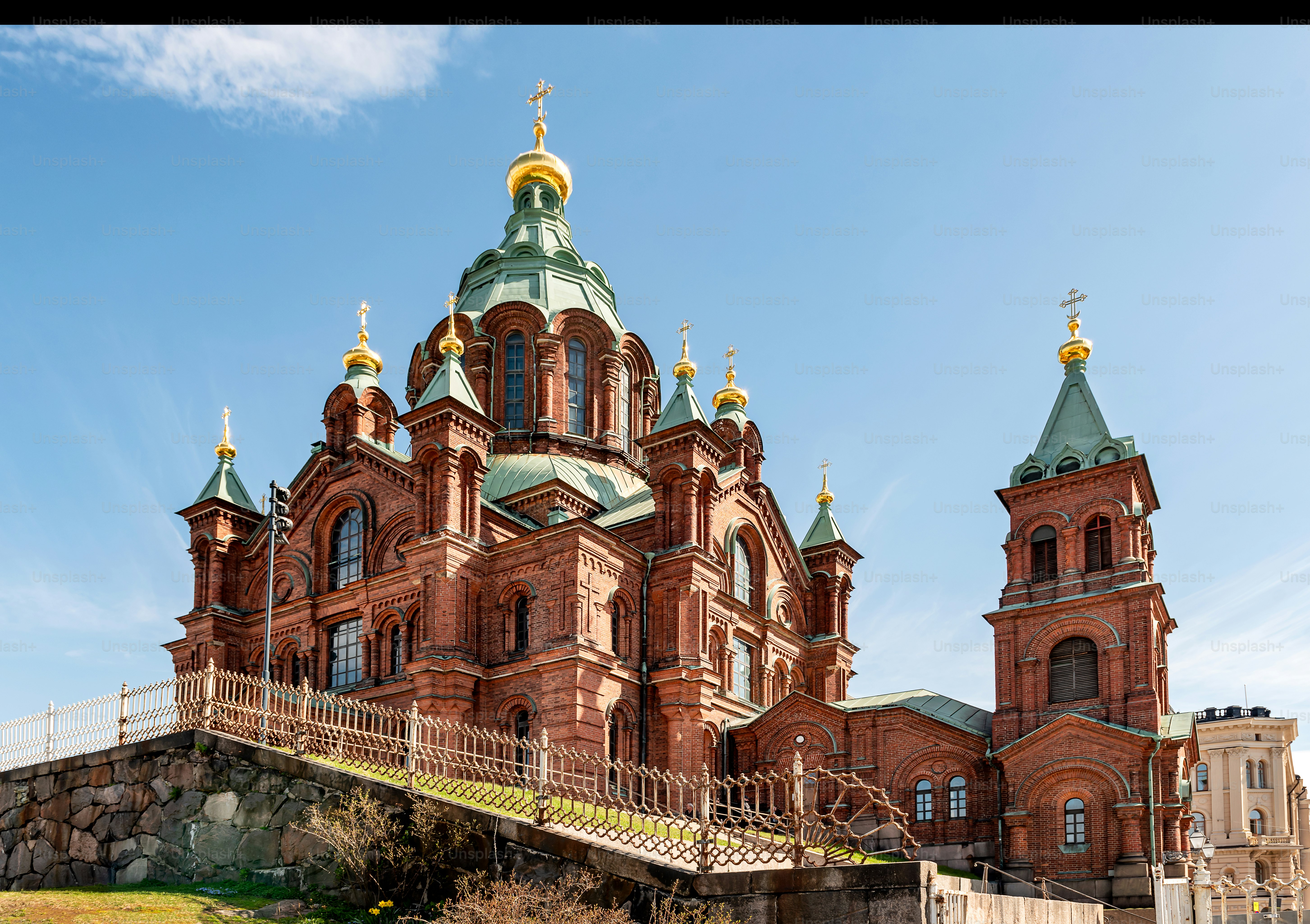 Uspenski Cathedral, Orthodox church in Helsinki, on a hill at sunny day. Red Church - Tourist destination In Finnish Capital, Finland.