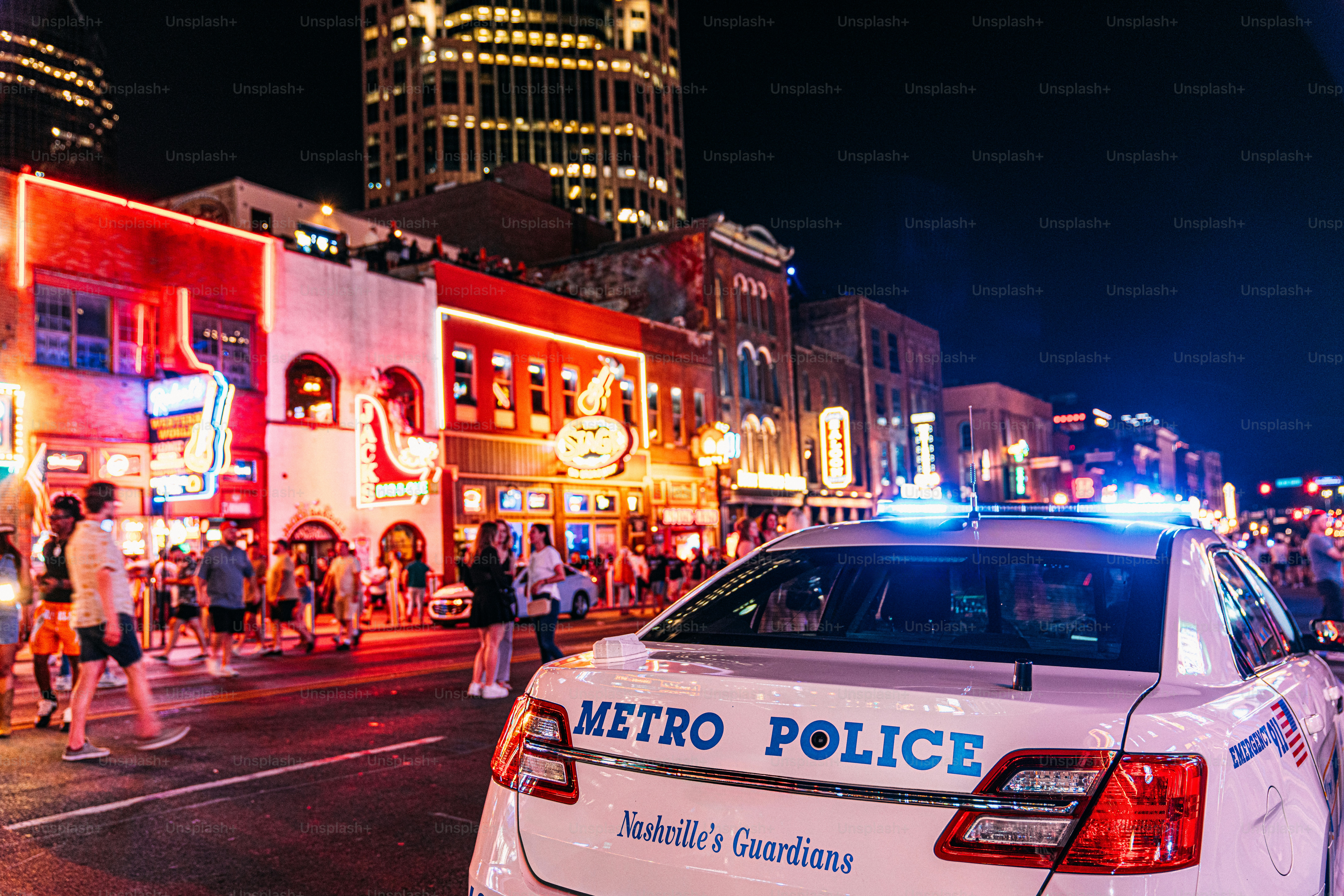 Nashville Metro Police Car Cruiser Parked on Broadway in Nashville to Deter Tourists and visitors from drug use, crime, or harassment at the bars and honky-tonks in the country music center, Downtown Nashville, Tennessee
