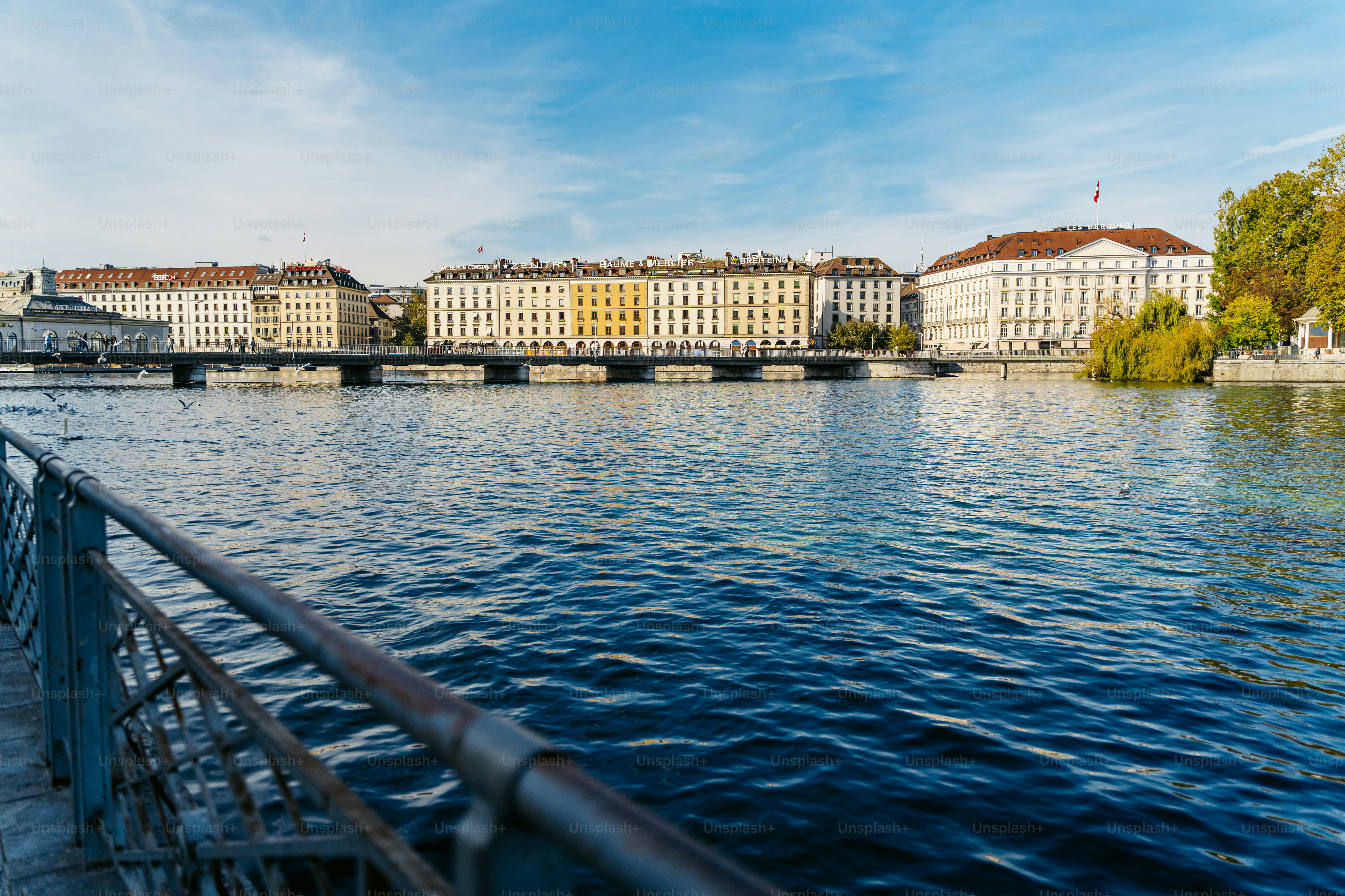 Buildings of famous brands on Bergues quay of Rhone river in Geneva ...