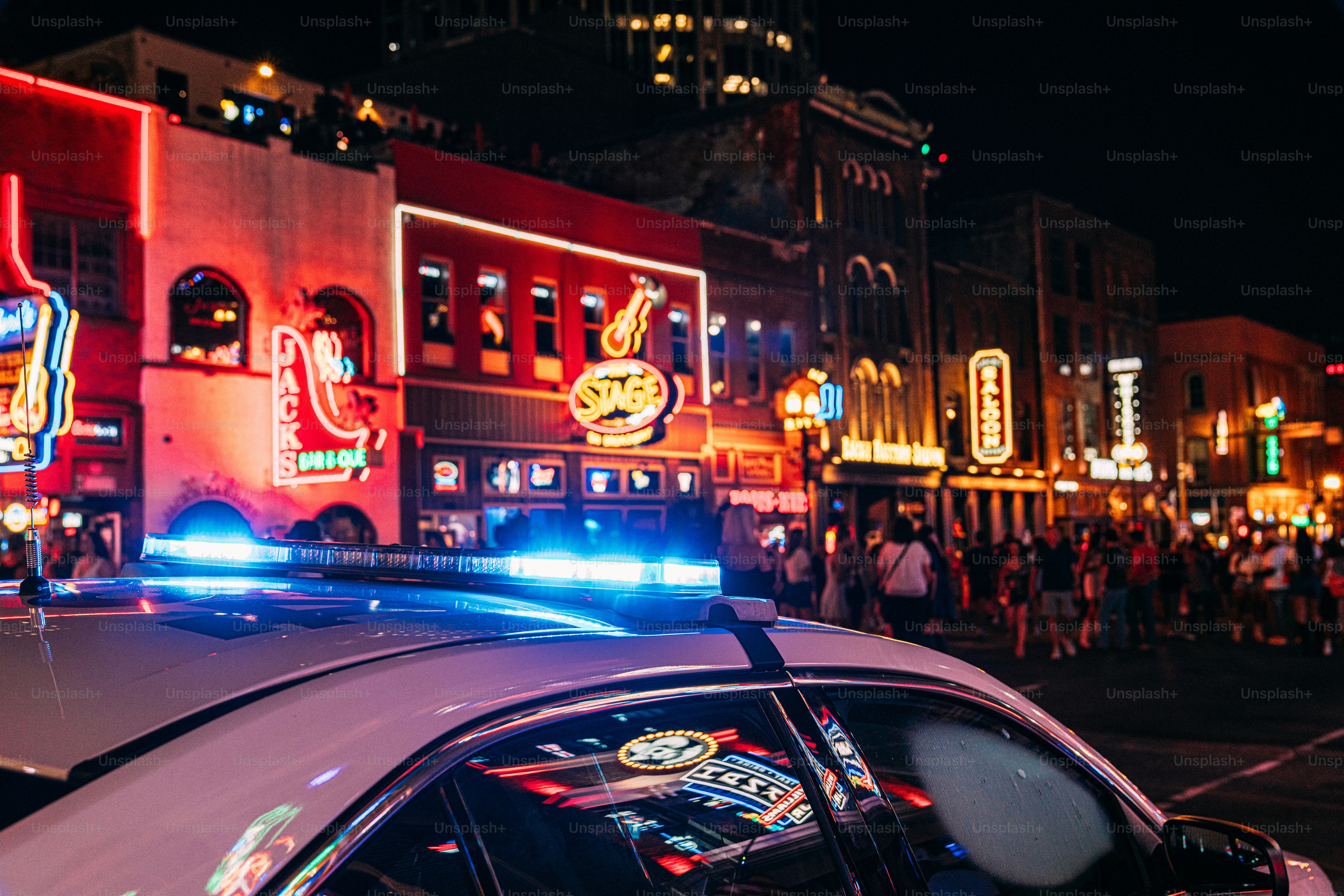 Nashville Metro Police Car Cruiser Parked on Broadway in Nashville to Deter Tourists and visitors from drug use, crime, or harassment at the bars and honky-tonks in the country music center, Downtown Nashville, Tennessee