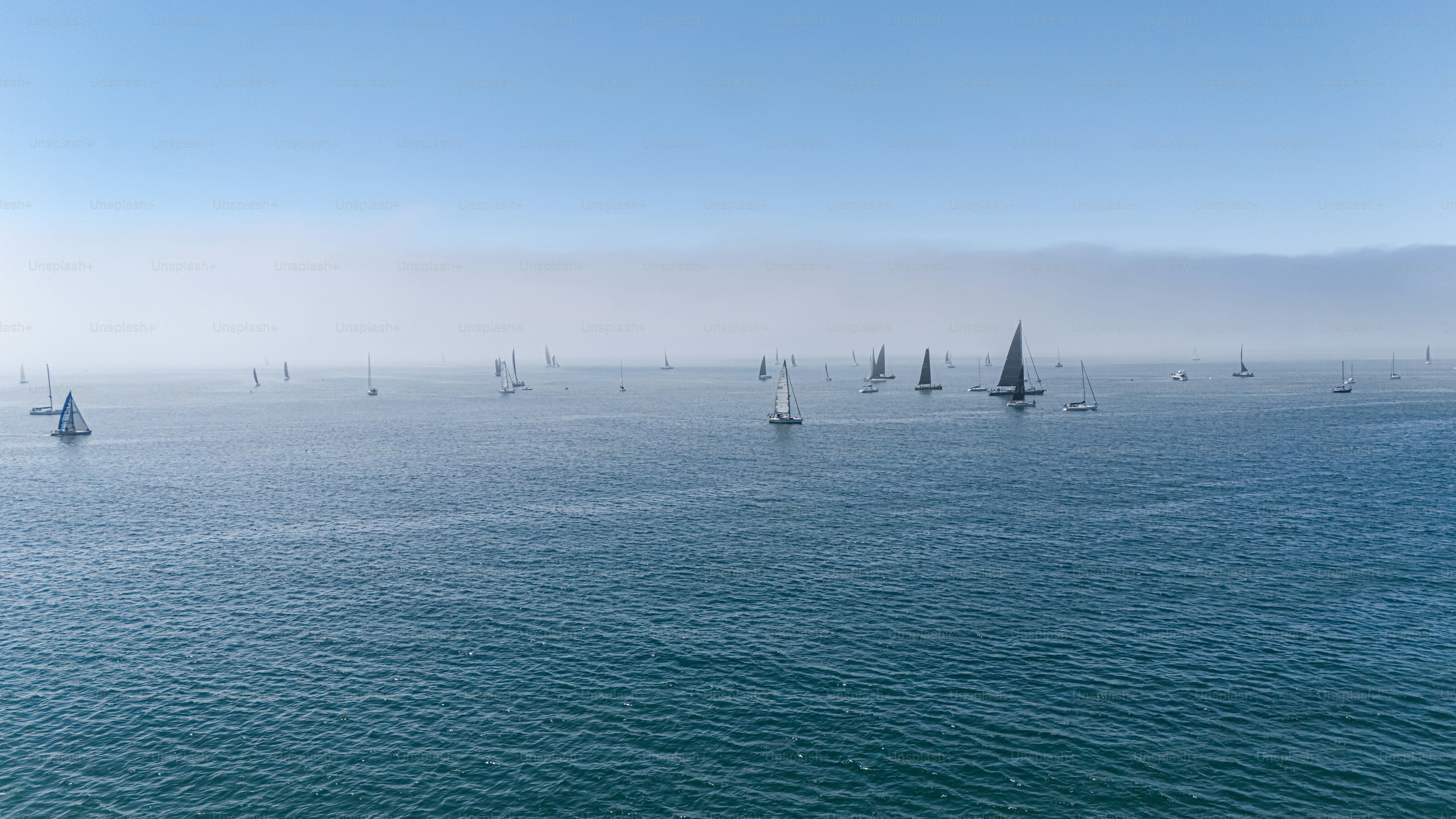 Foggy morning in Santa Barbara over ocean with sailboats