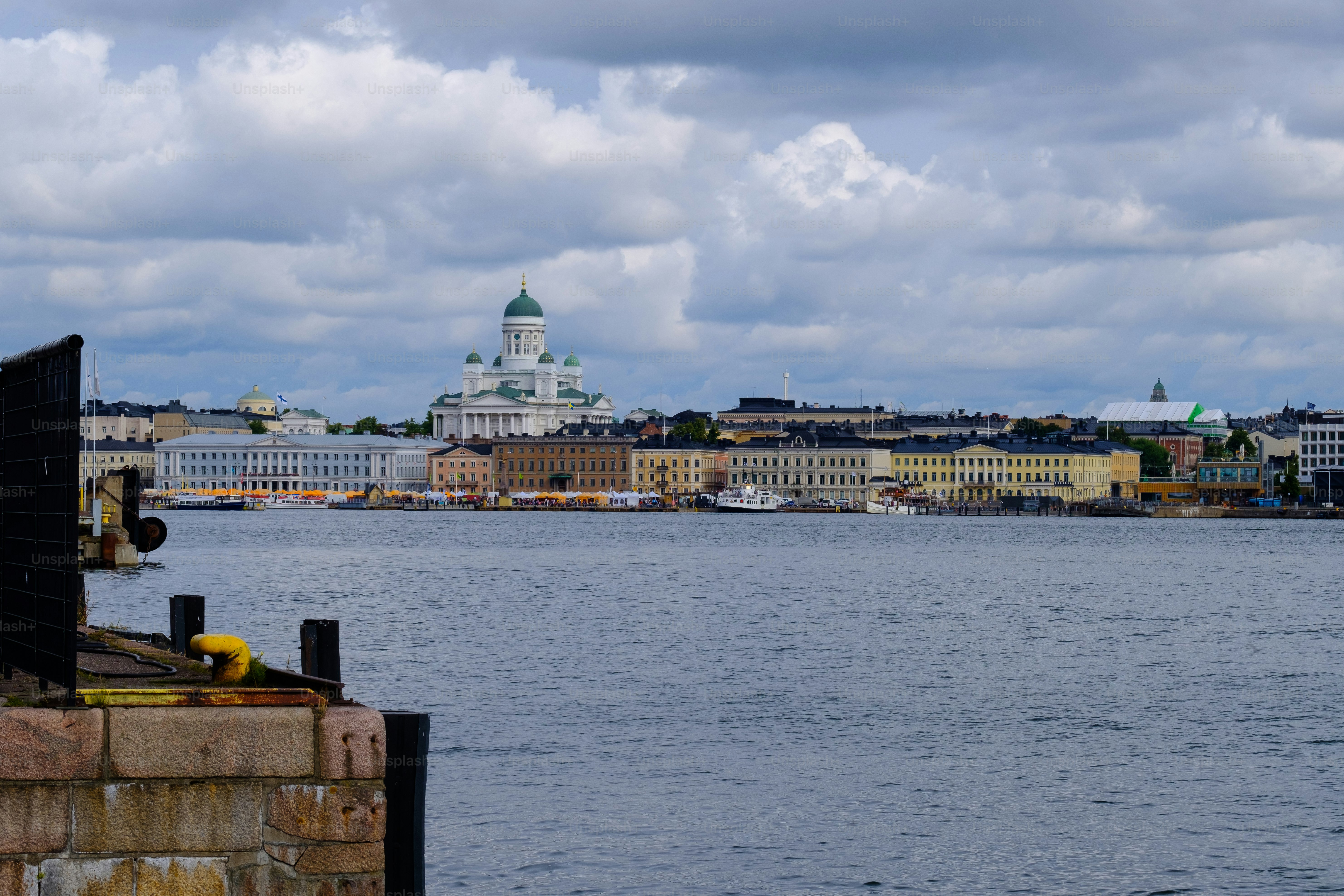 Helsinki / Finland - JULY 31, 2023: Downtown Helsinki city skyline with presidential palace and Helsinki cathedral in sight.