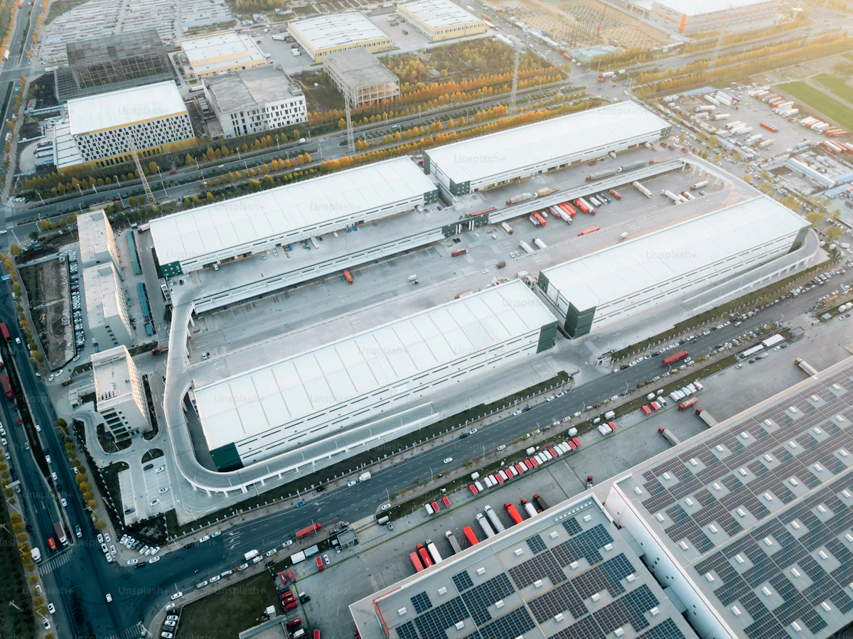 Aerial view of a giant logistics campus at golden hour