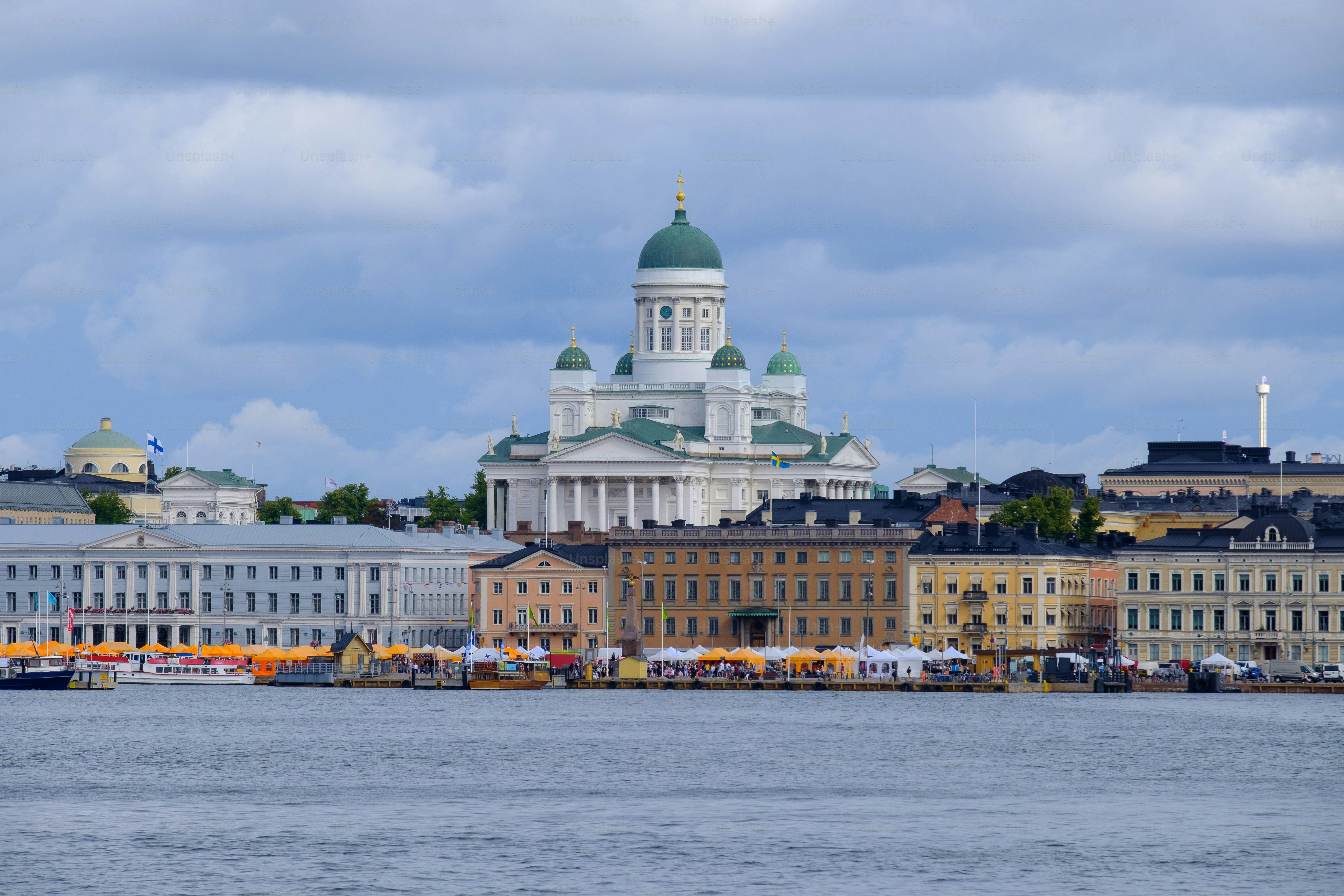Helsinki / Finland - JULY 31, 2023:.View of downtown Helsinki with market square in the foreground. The Helsinki cathedral in the background.