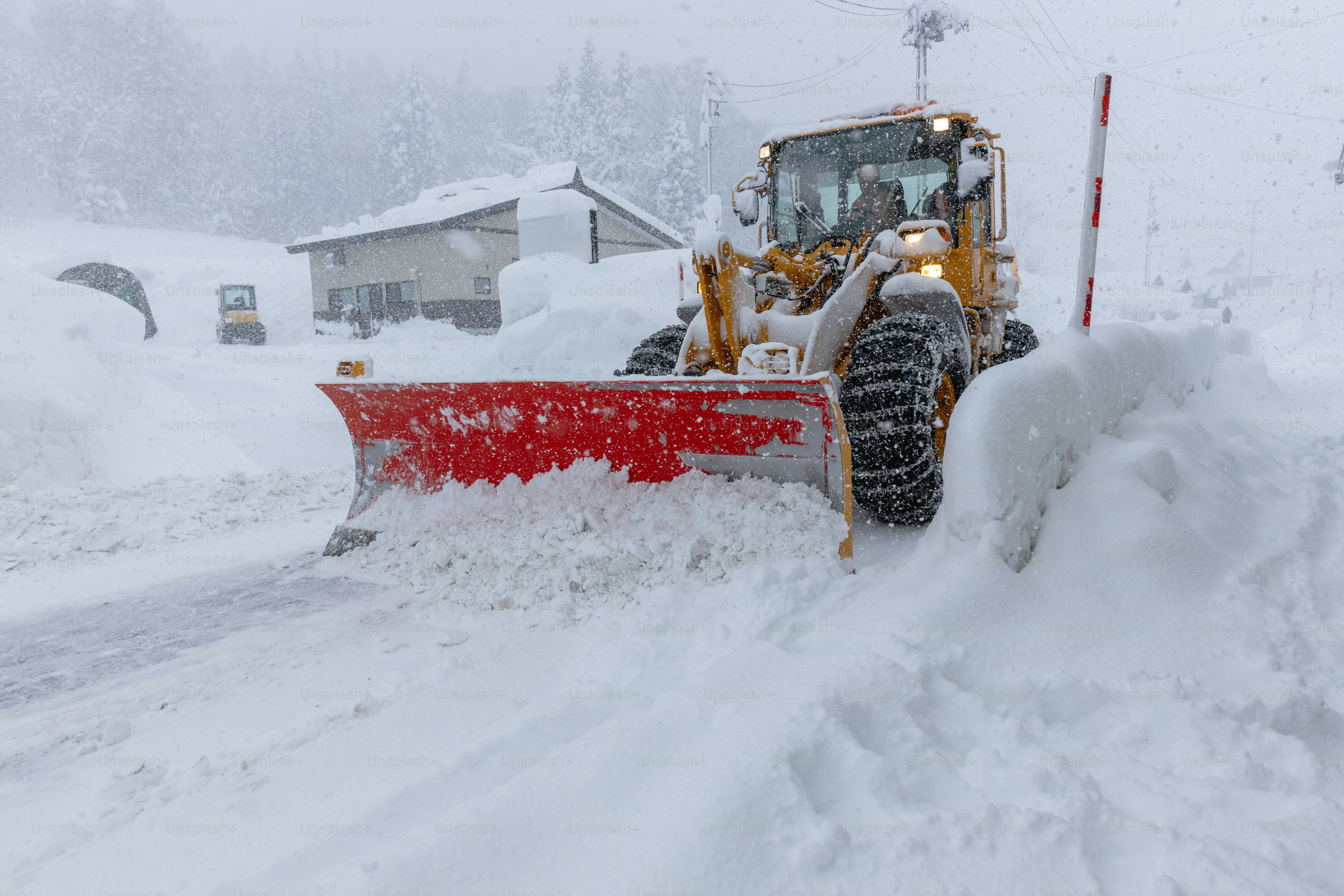 A snowplow clearing the snow from roads. Yamagata, Japan.