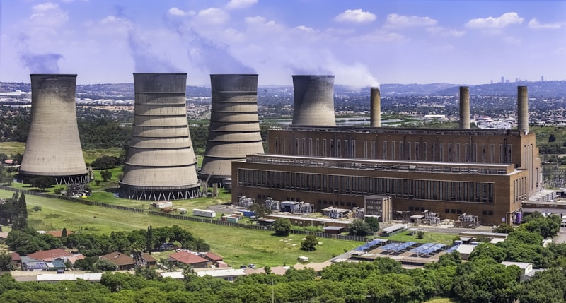 Coal powered power station with Johannesburg cityscape in the background