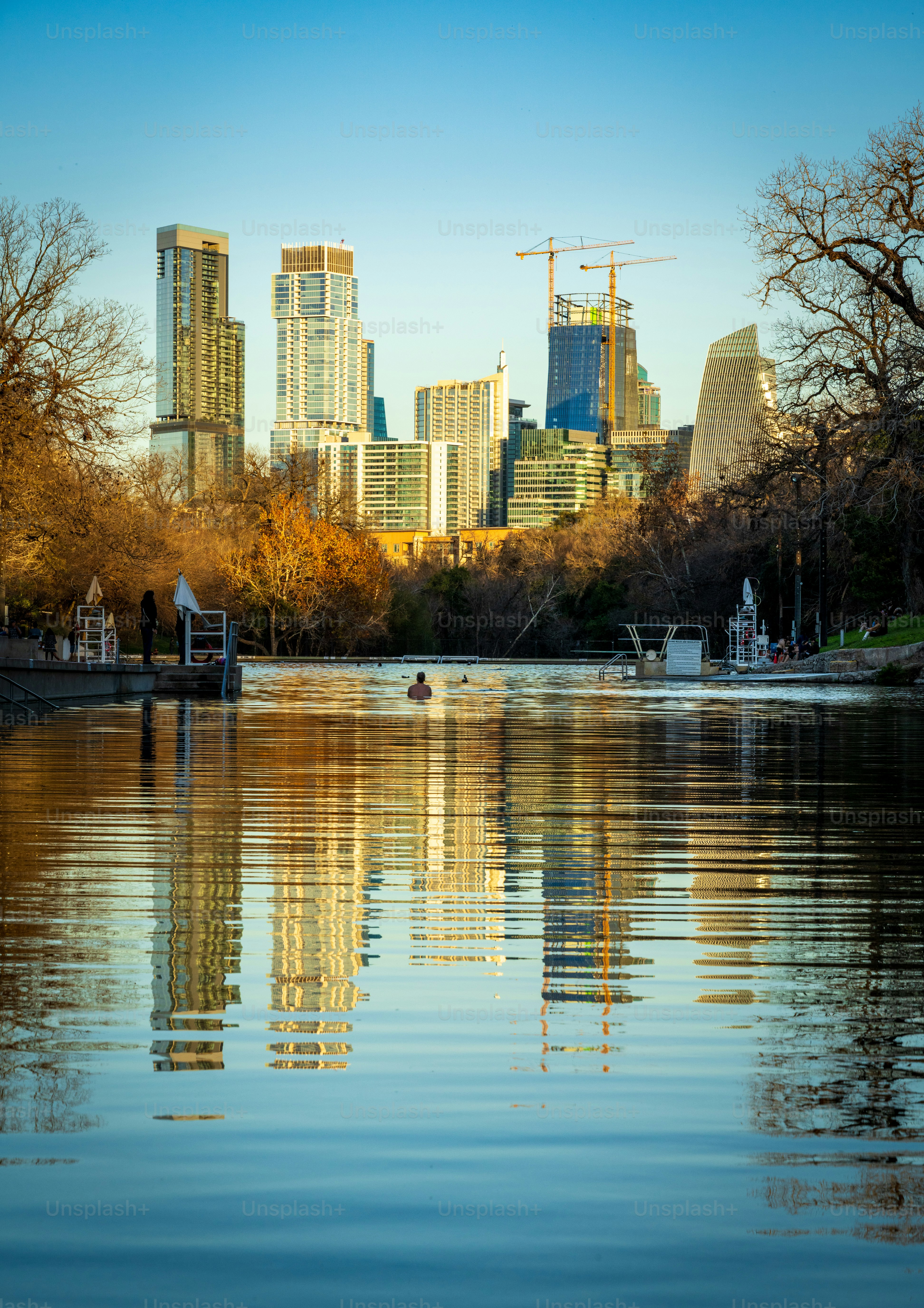 City skyline of Austin Texas from the swimming pool at Barton Springs in Zilker metropolitan park