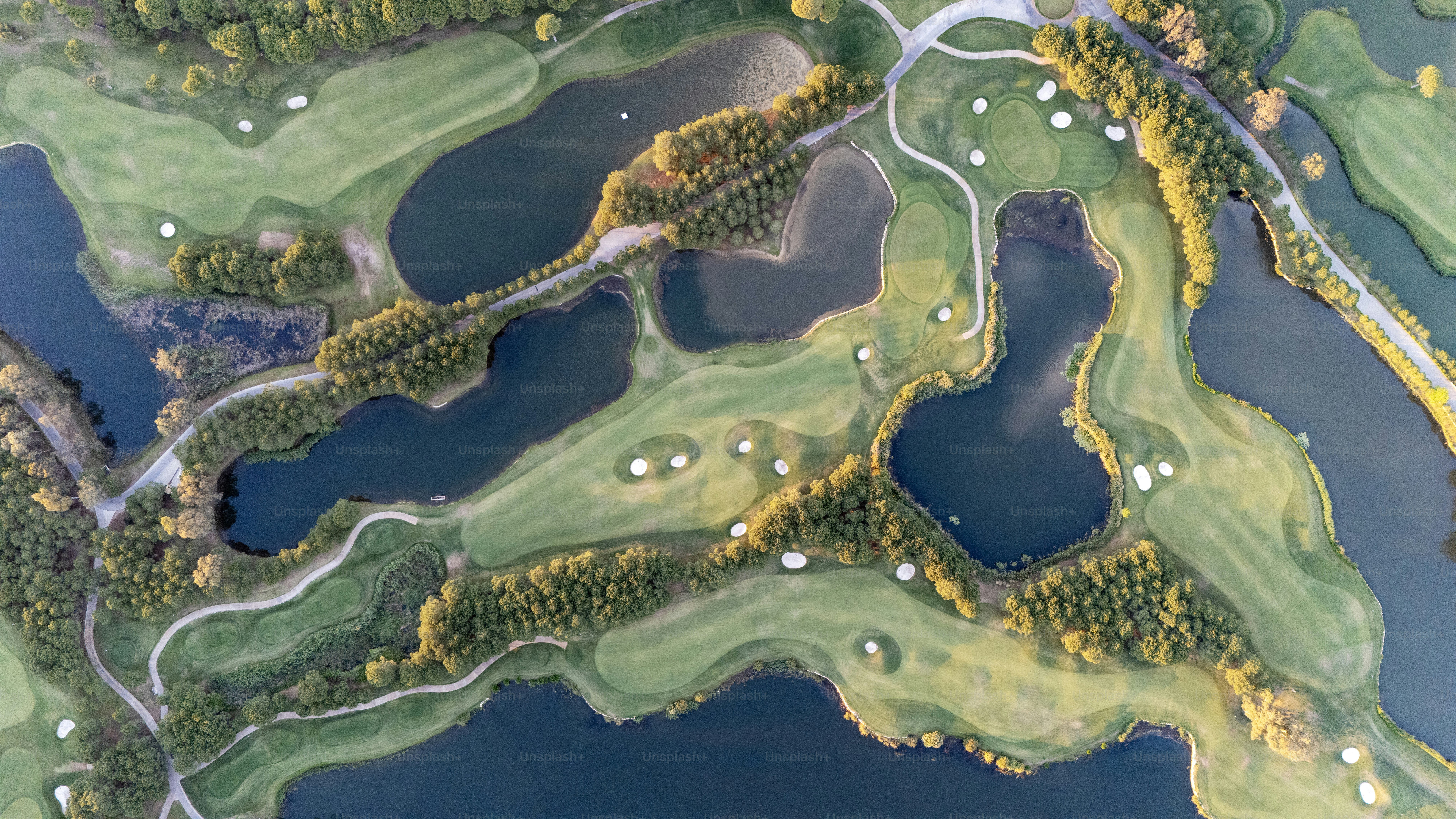 Aerial view of a large Golf Courses and ponds, Drone shot