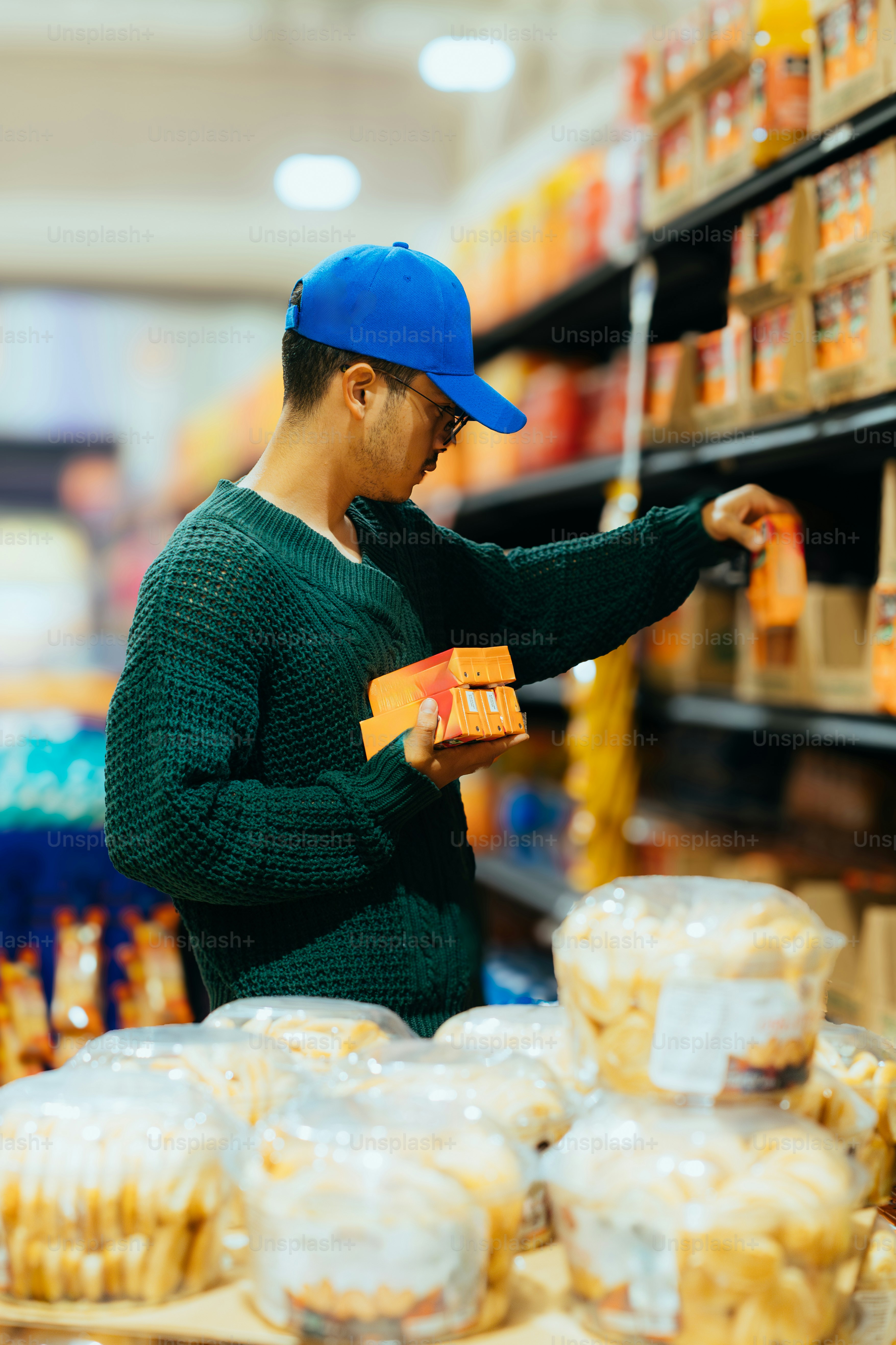 Man shops for food products in a grocery store.