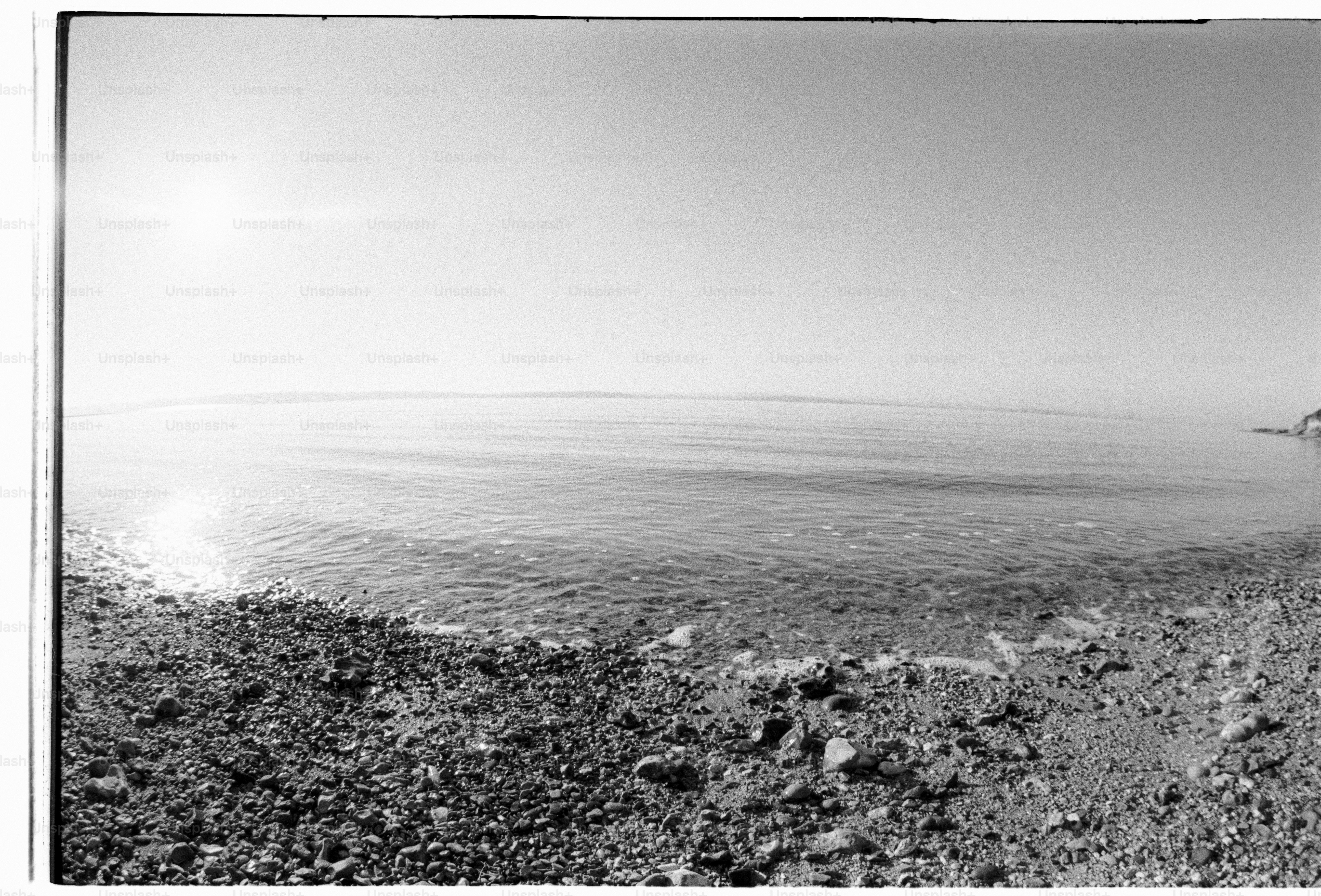 Sun shines over a calm sea.