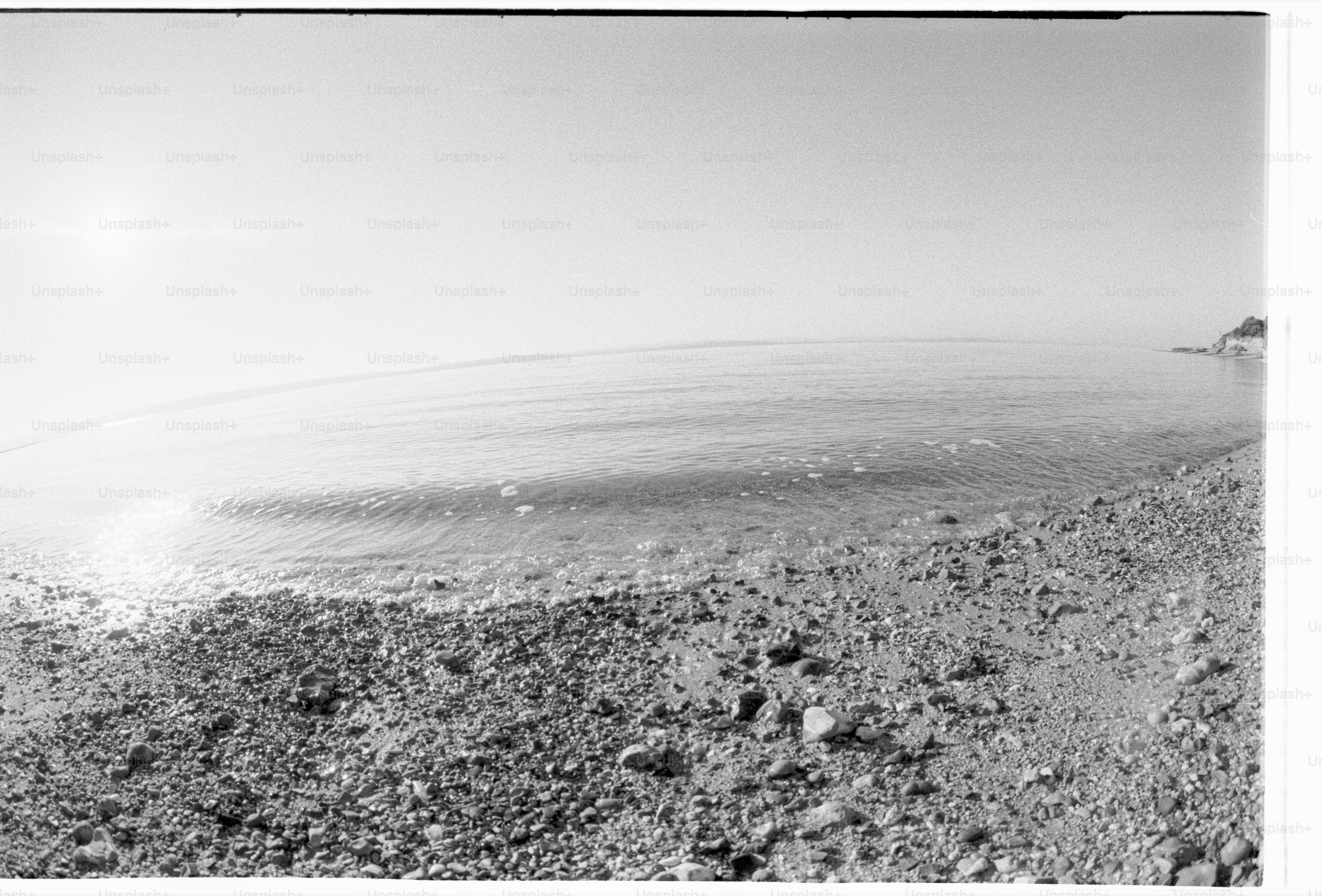 The beach meets a calm, serene sea.