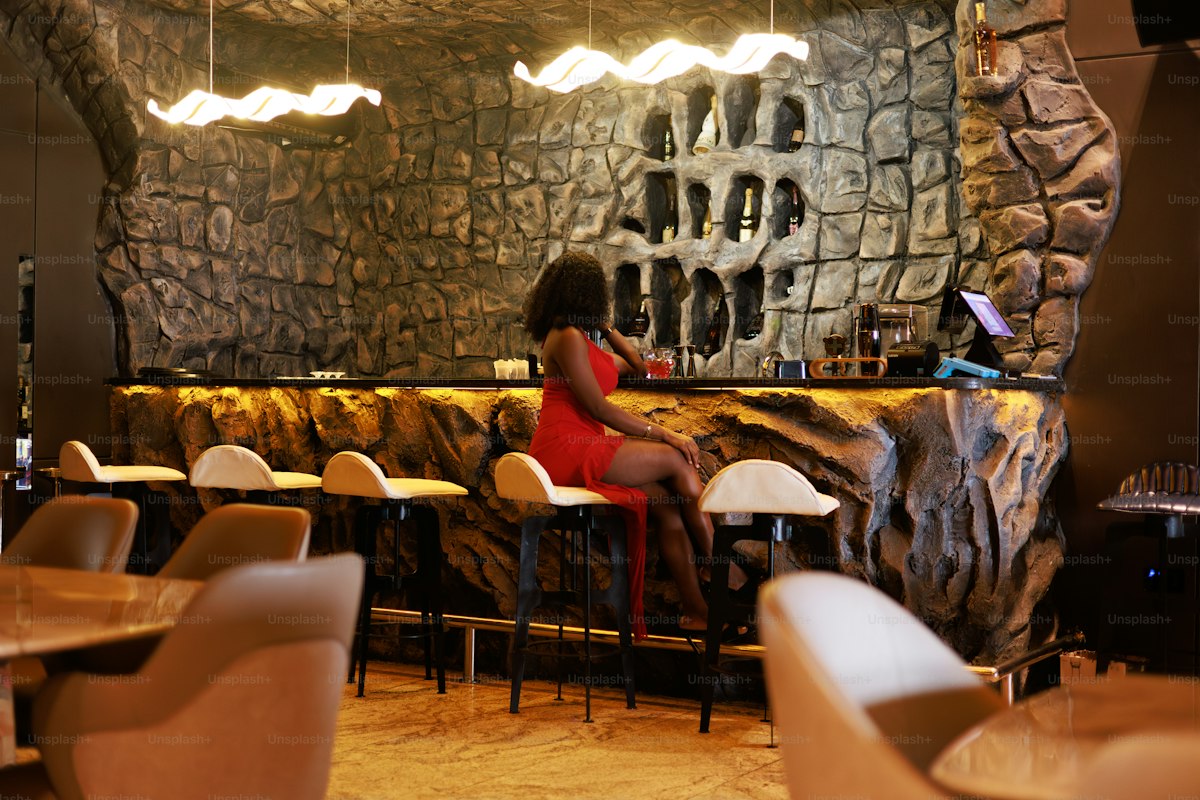 Woman at stone bar