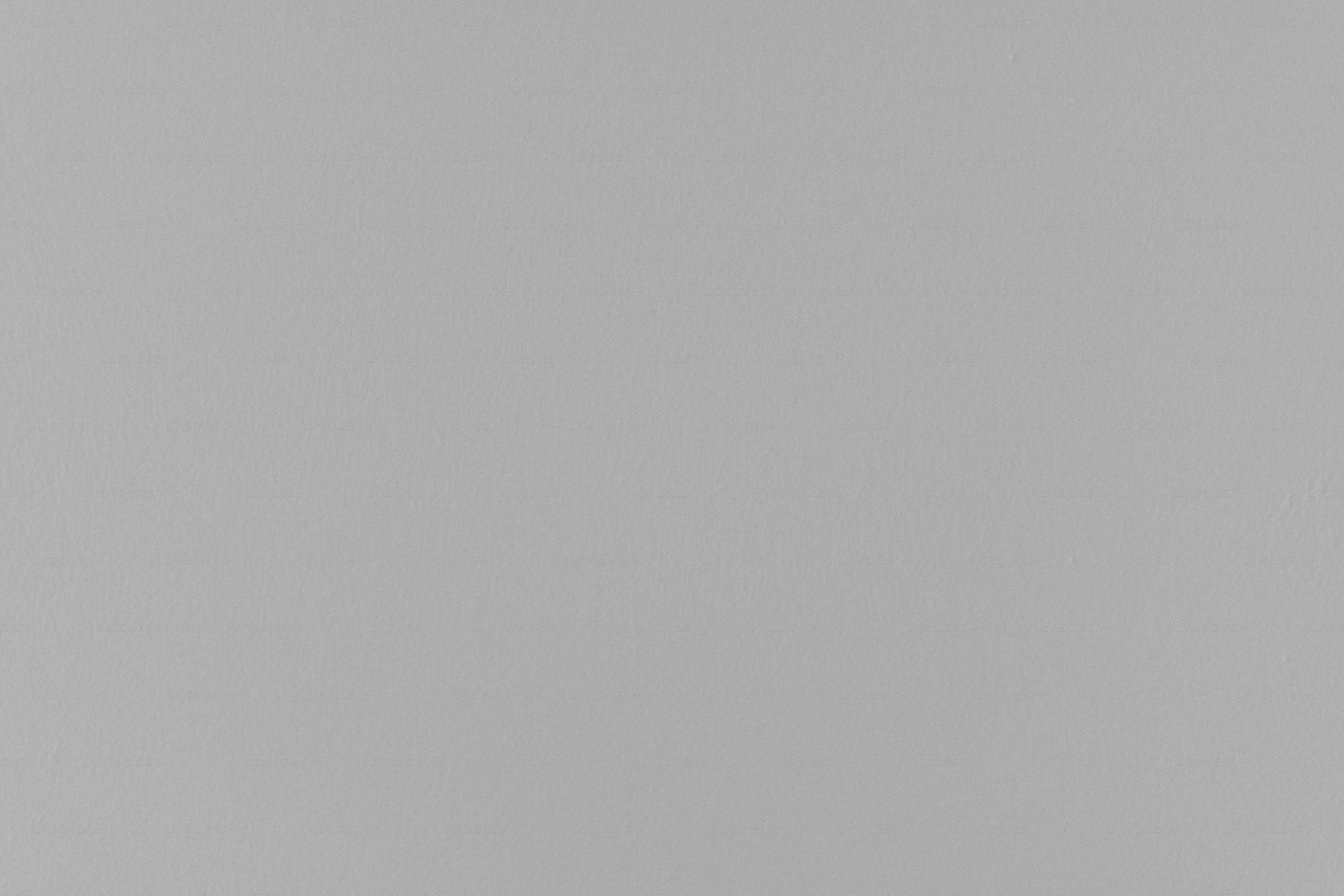 A plain, light gray background.