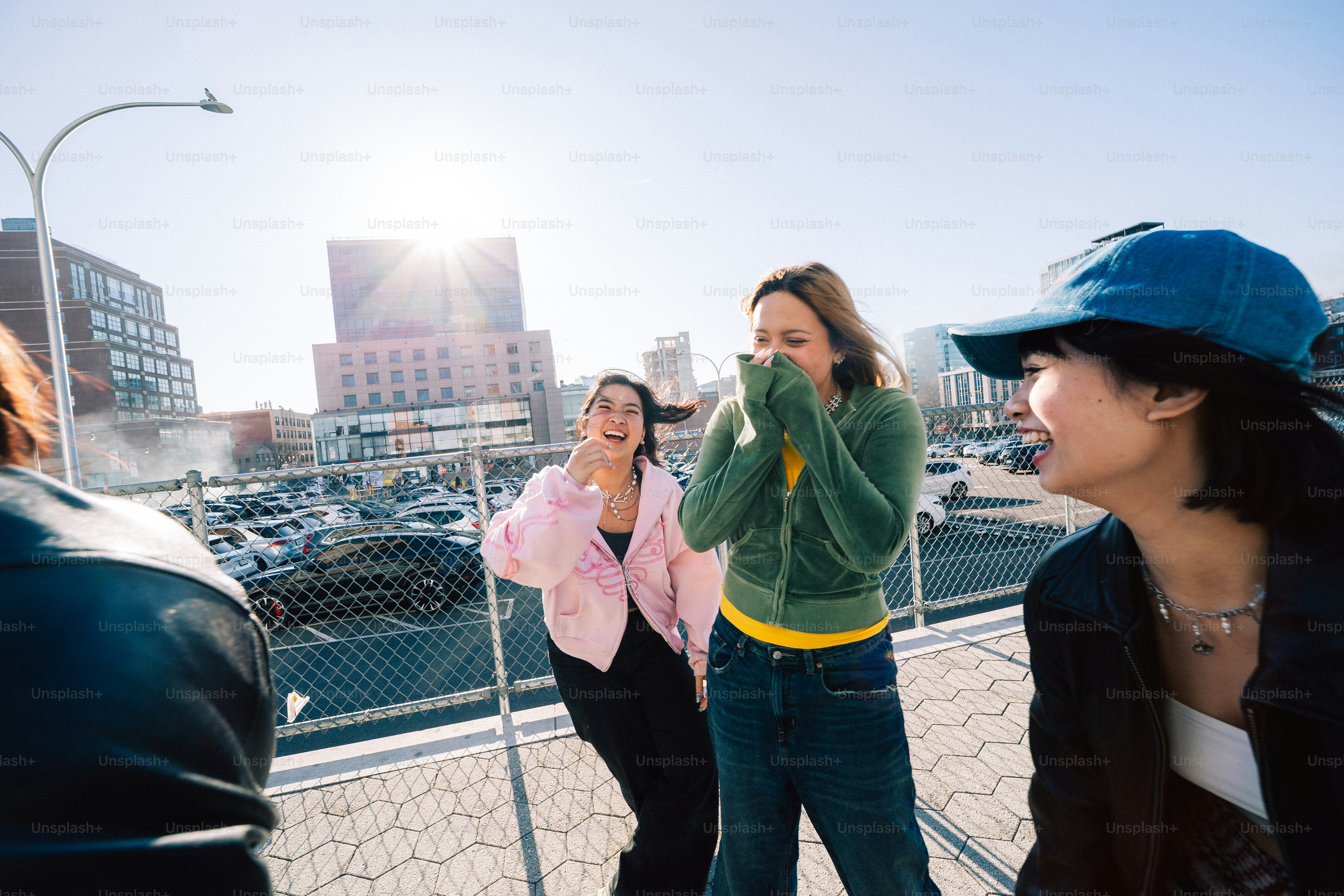 Friends laugh and enjoy the sunny day outside.