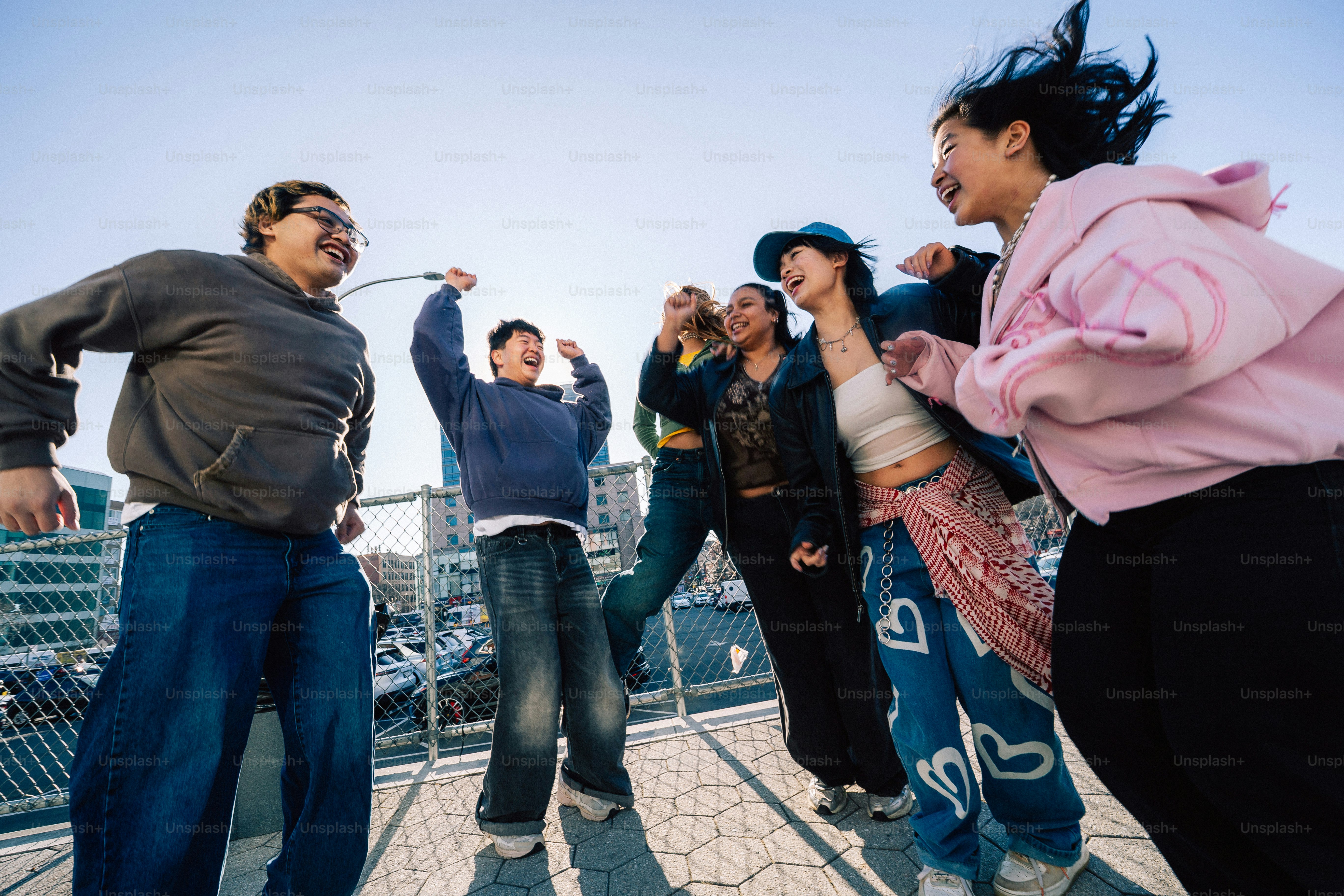 A group of friends are dancing and having fun.