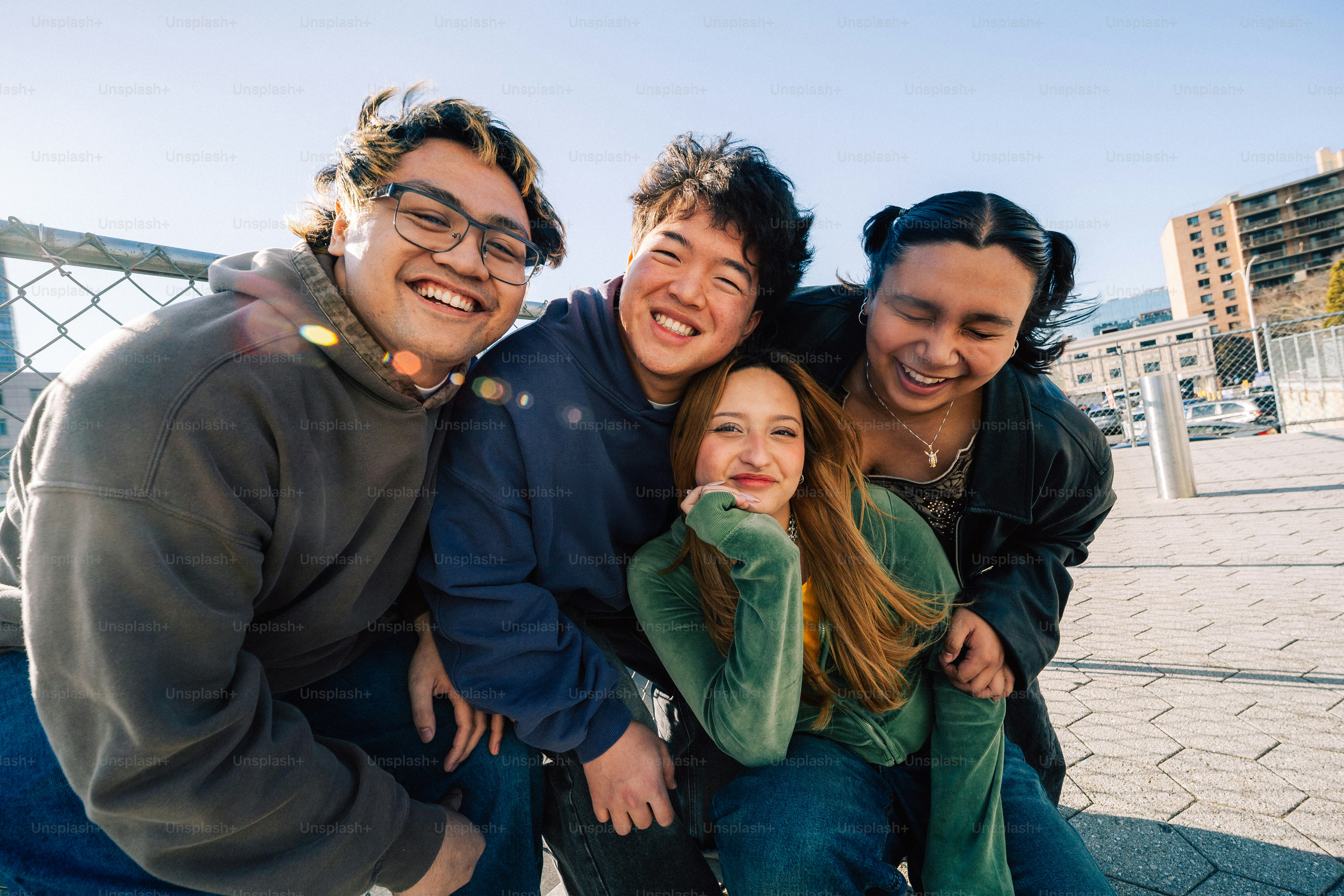 Group of friends happily posing for a picture.