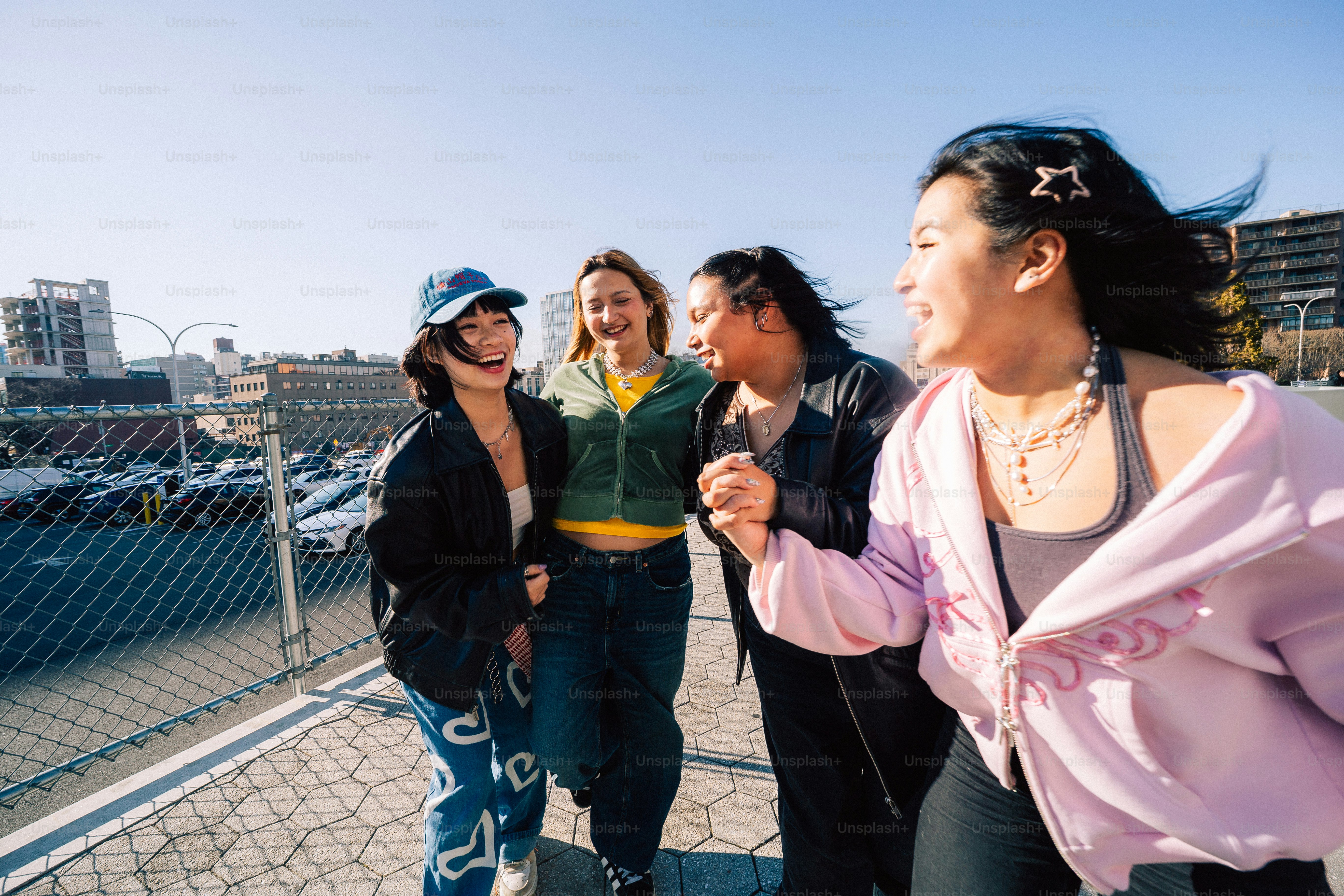 A group of friends share a laugh outdoors.