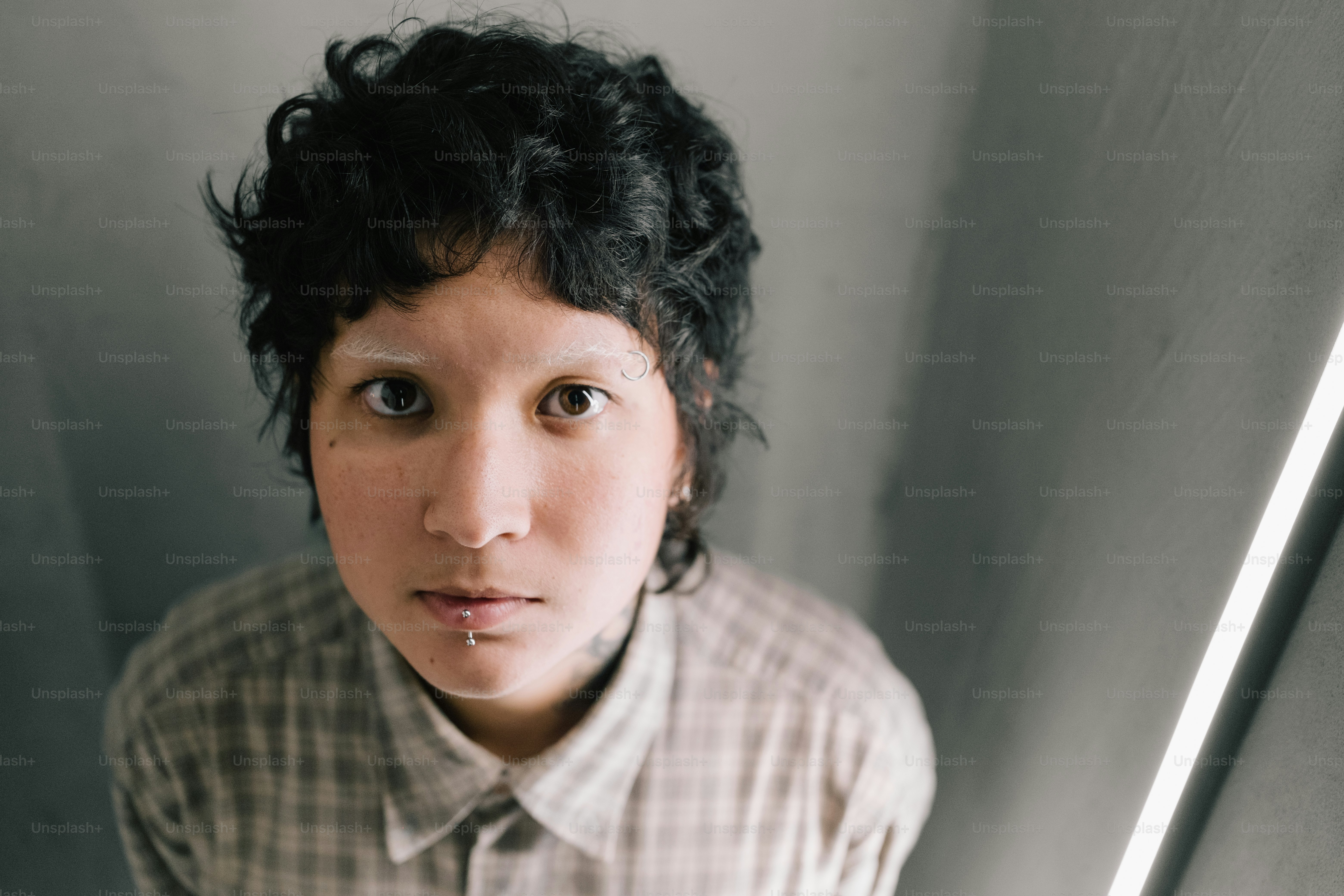 A person stares directly at the camera.