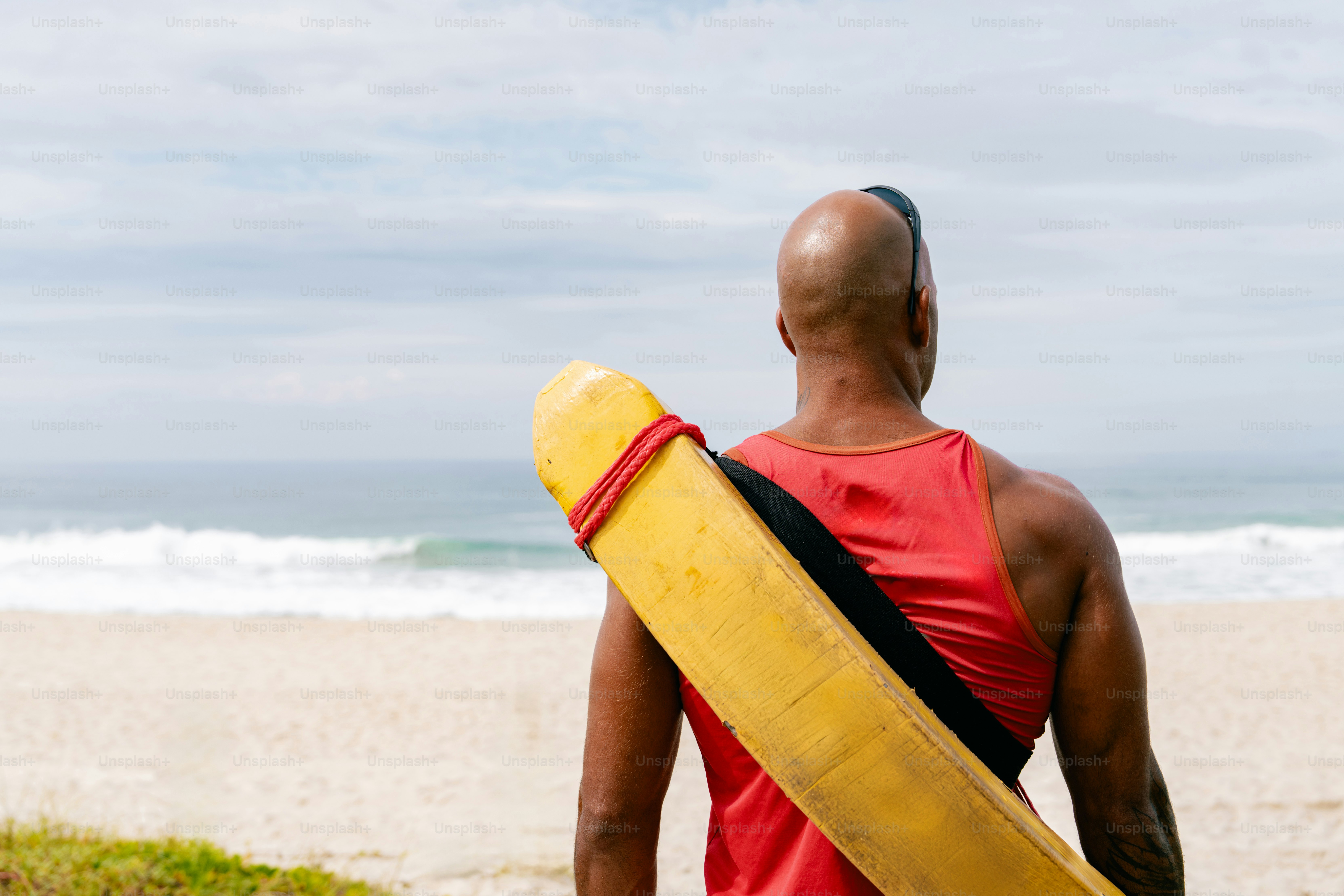 A lifeguard watches over the sandy beach.