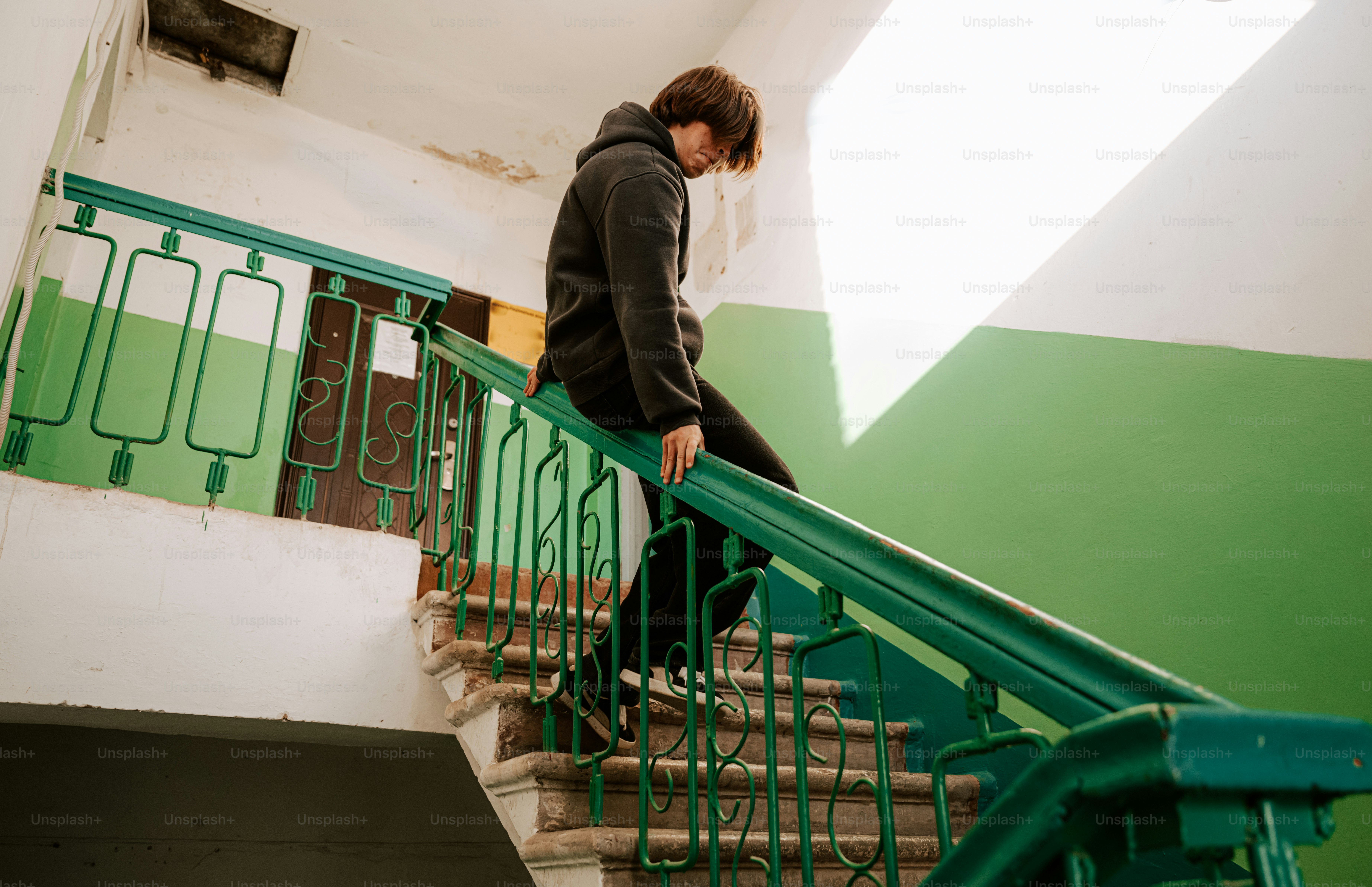 A person walks down a staircase.