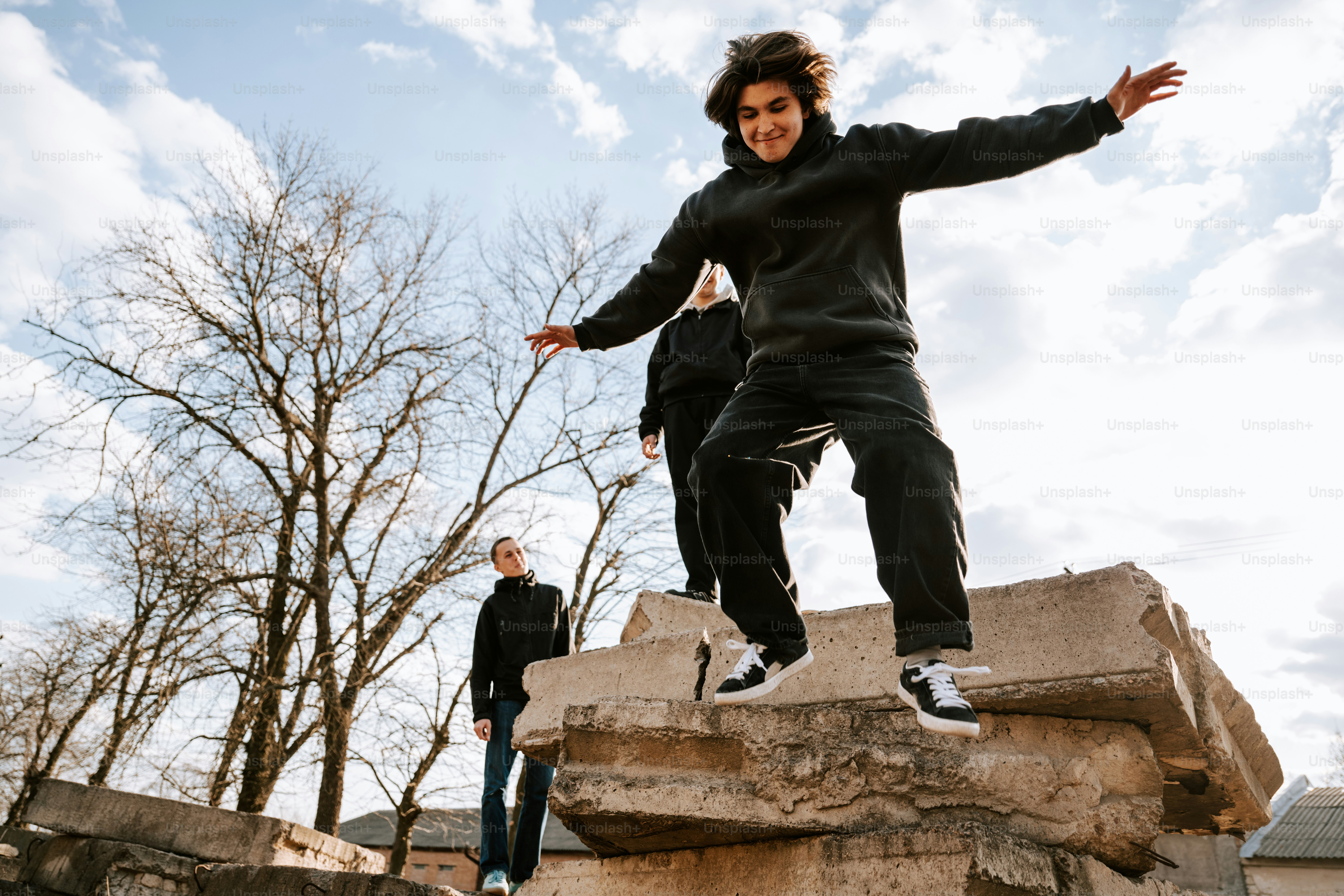 Group of friends jumping and having fun. photo – Diversity Image on ...