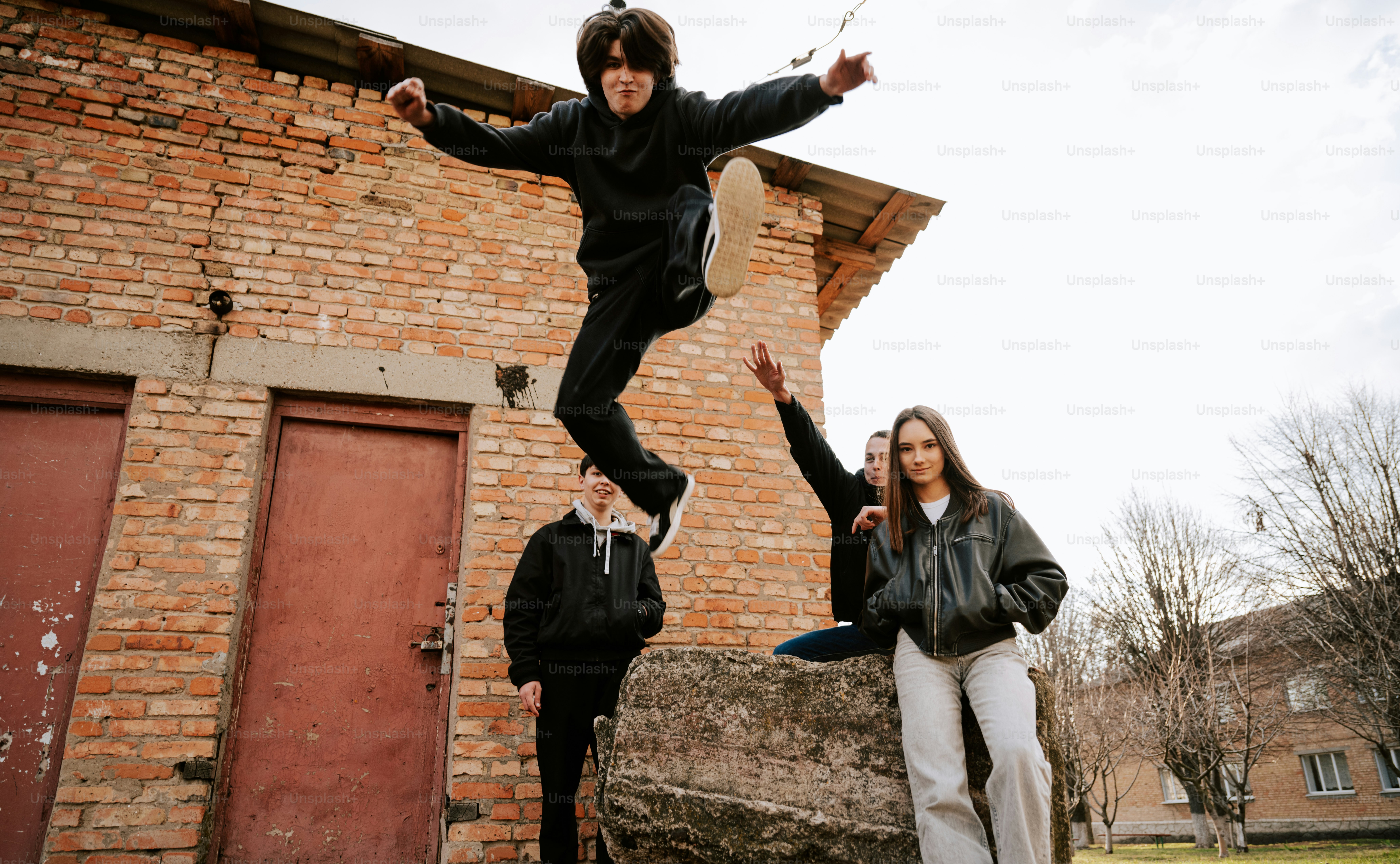 Group of friends jumping and having fun.