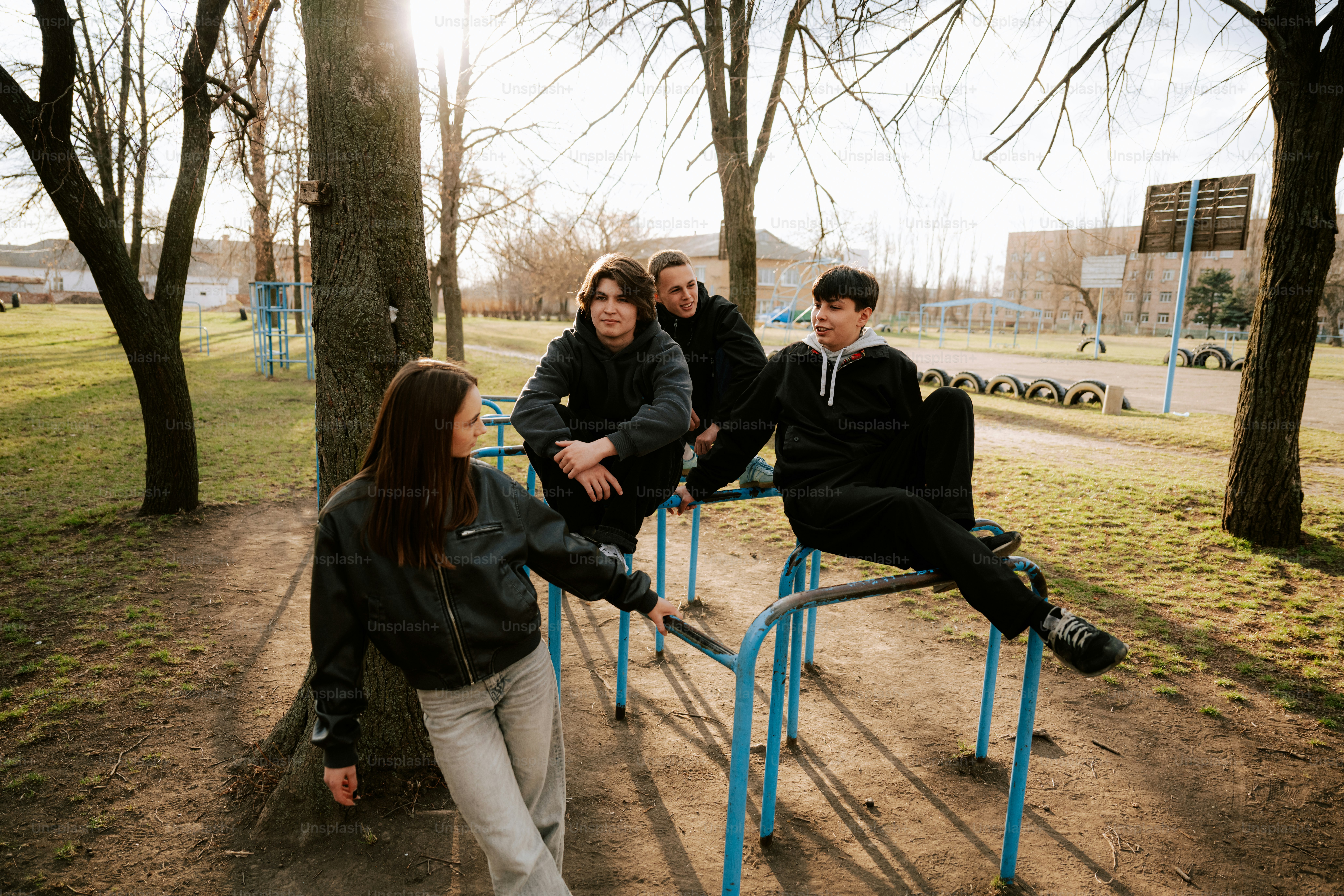 A group of friends hangs out outdoors together.