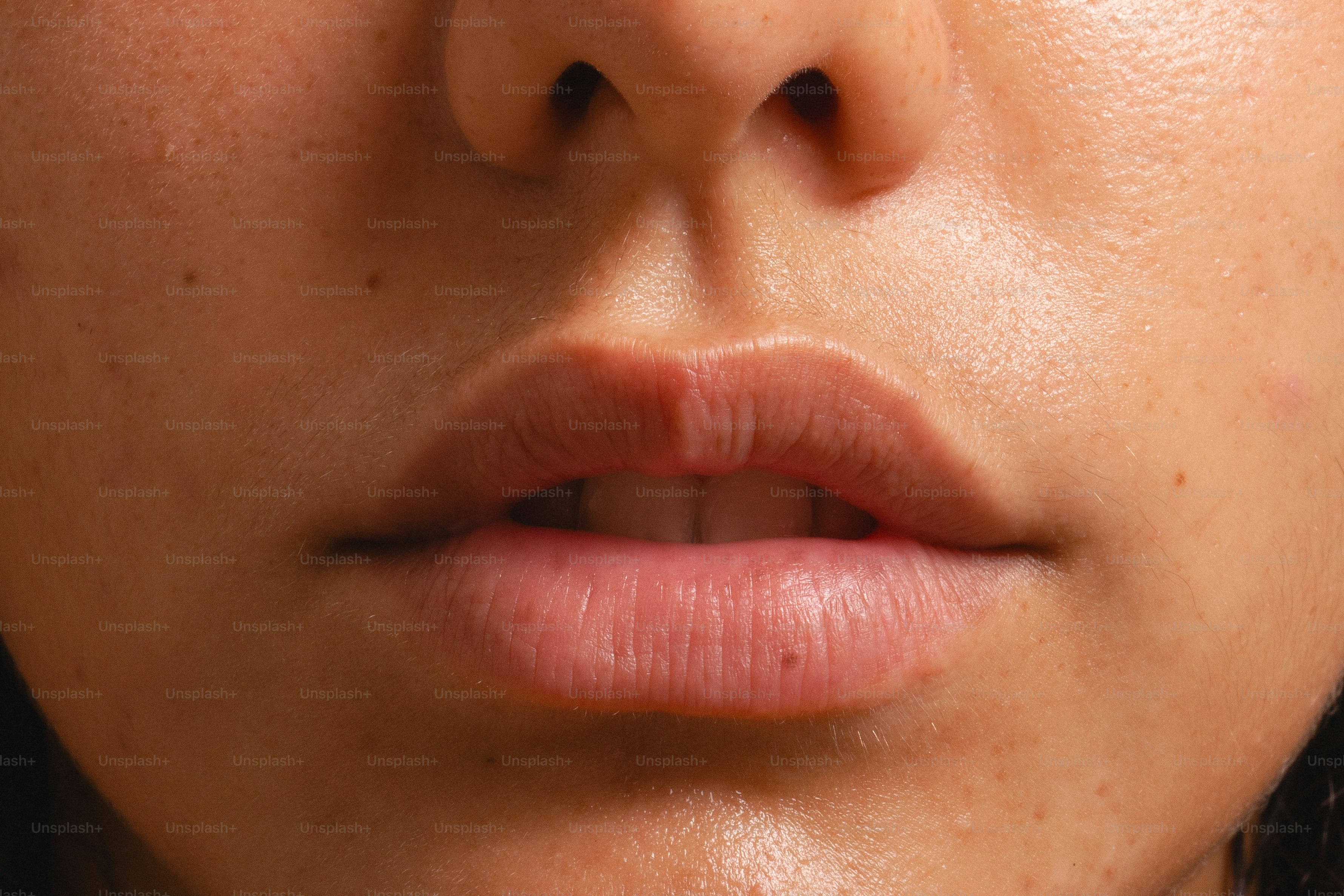 Close-up of a person's lips and nose.