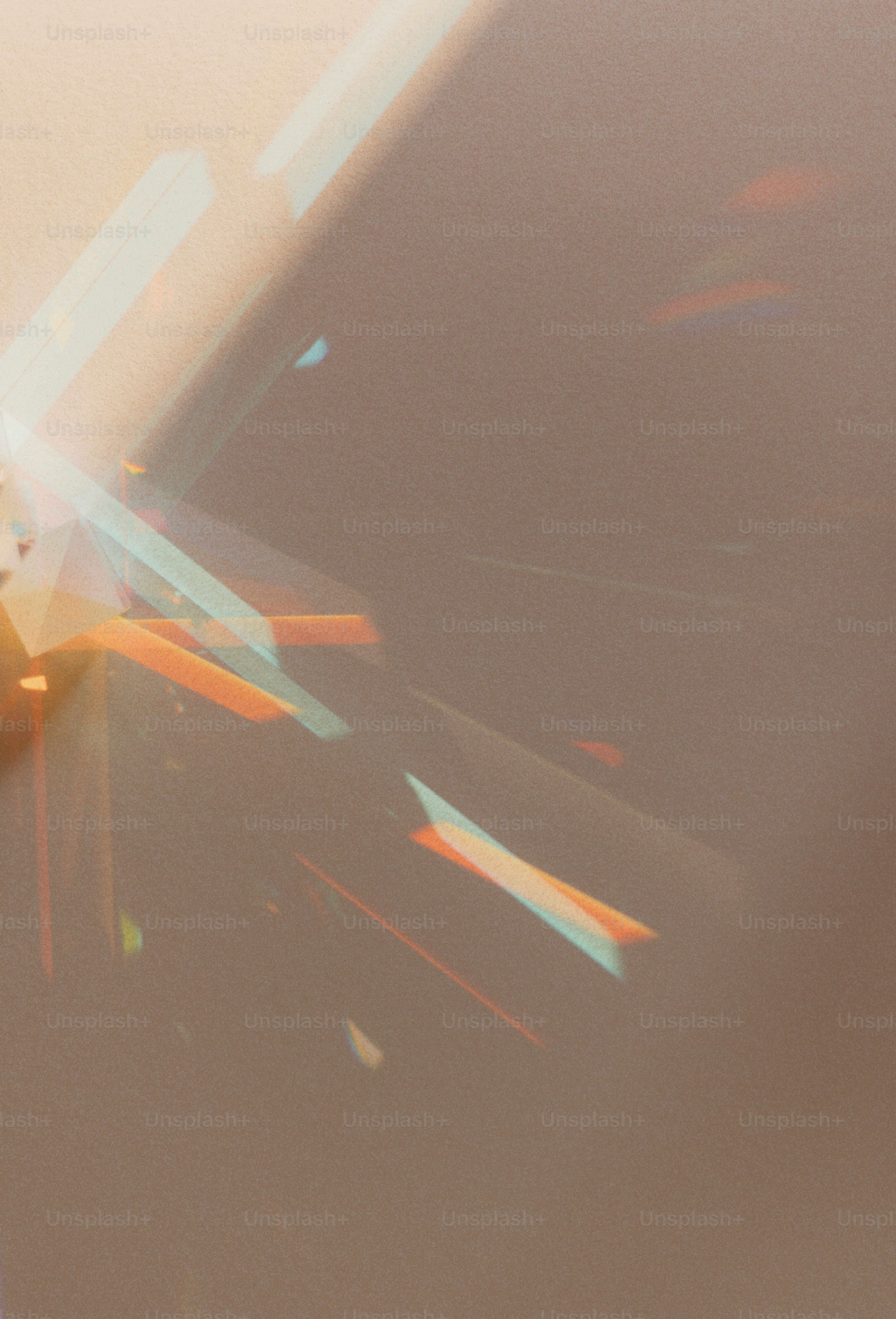 Light refracts onto a wall, creating colorful highlights.