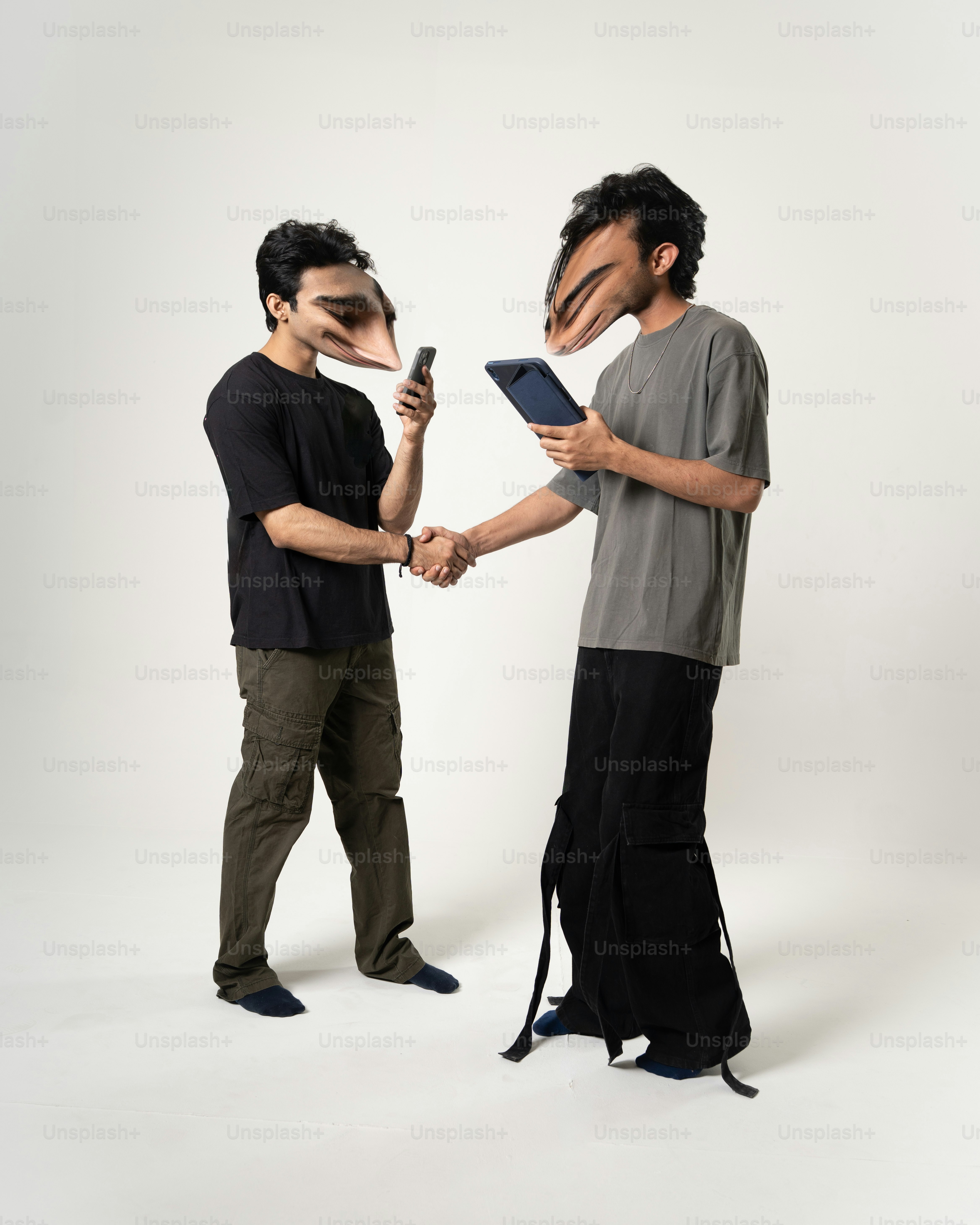 Two people shake hands with bird heads.