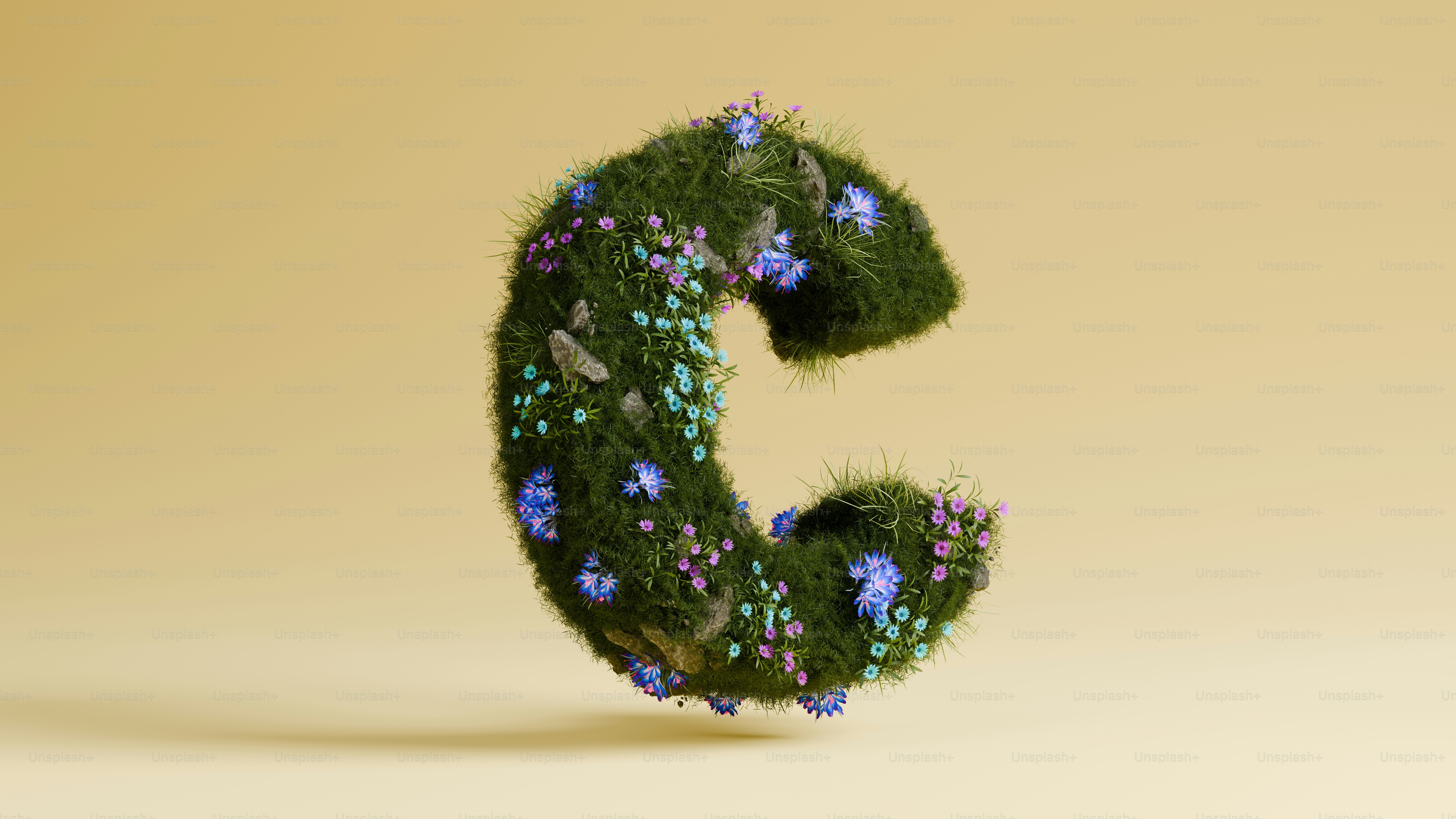 La lettre « c » est faite d’herbe et de fleurs.