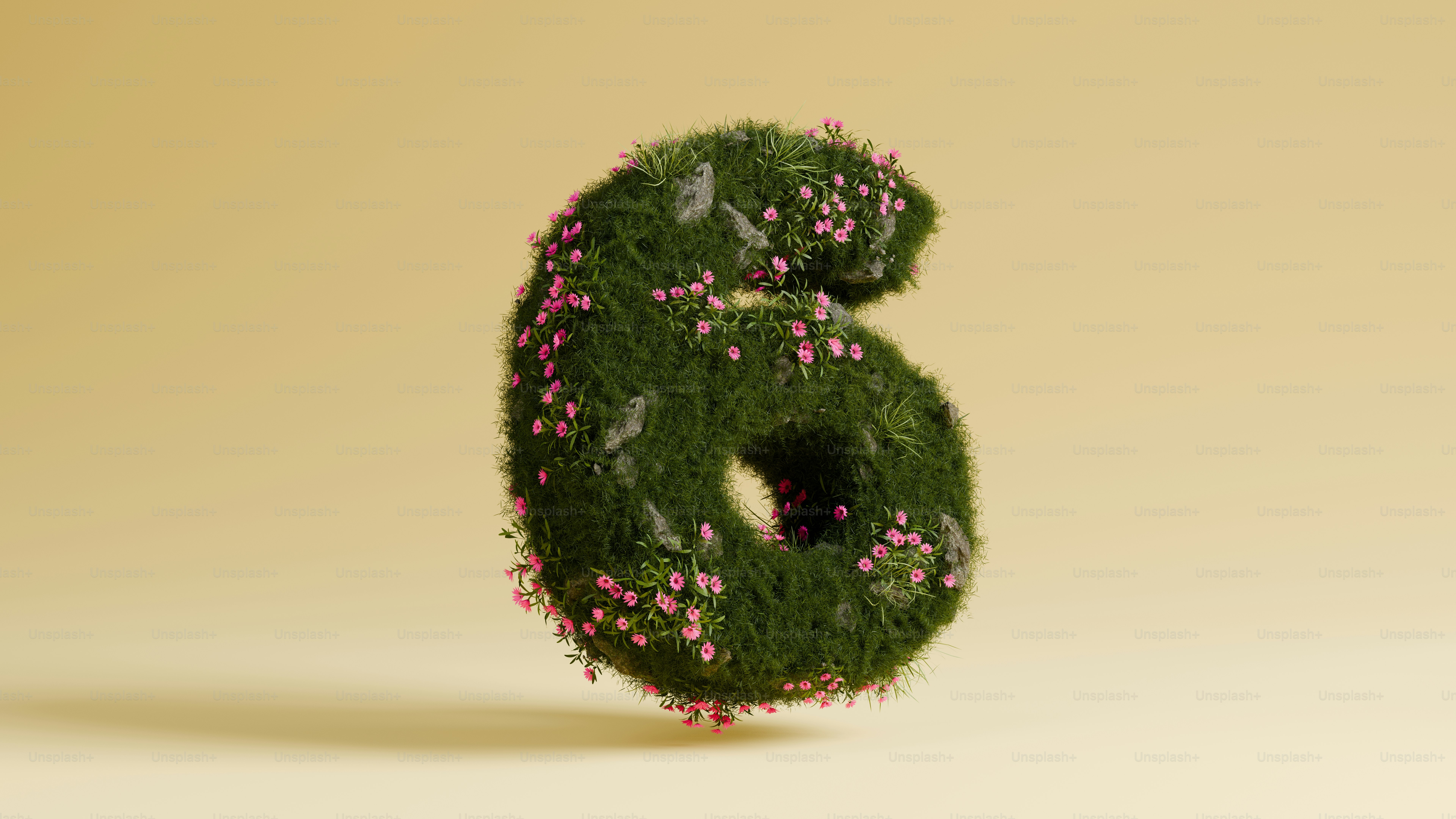 A green number six covered in flowers.