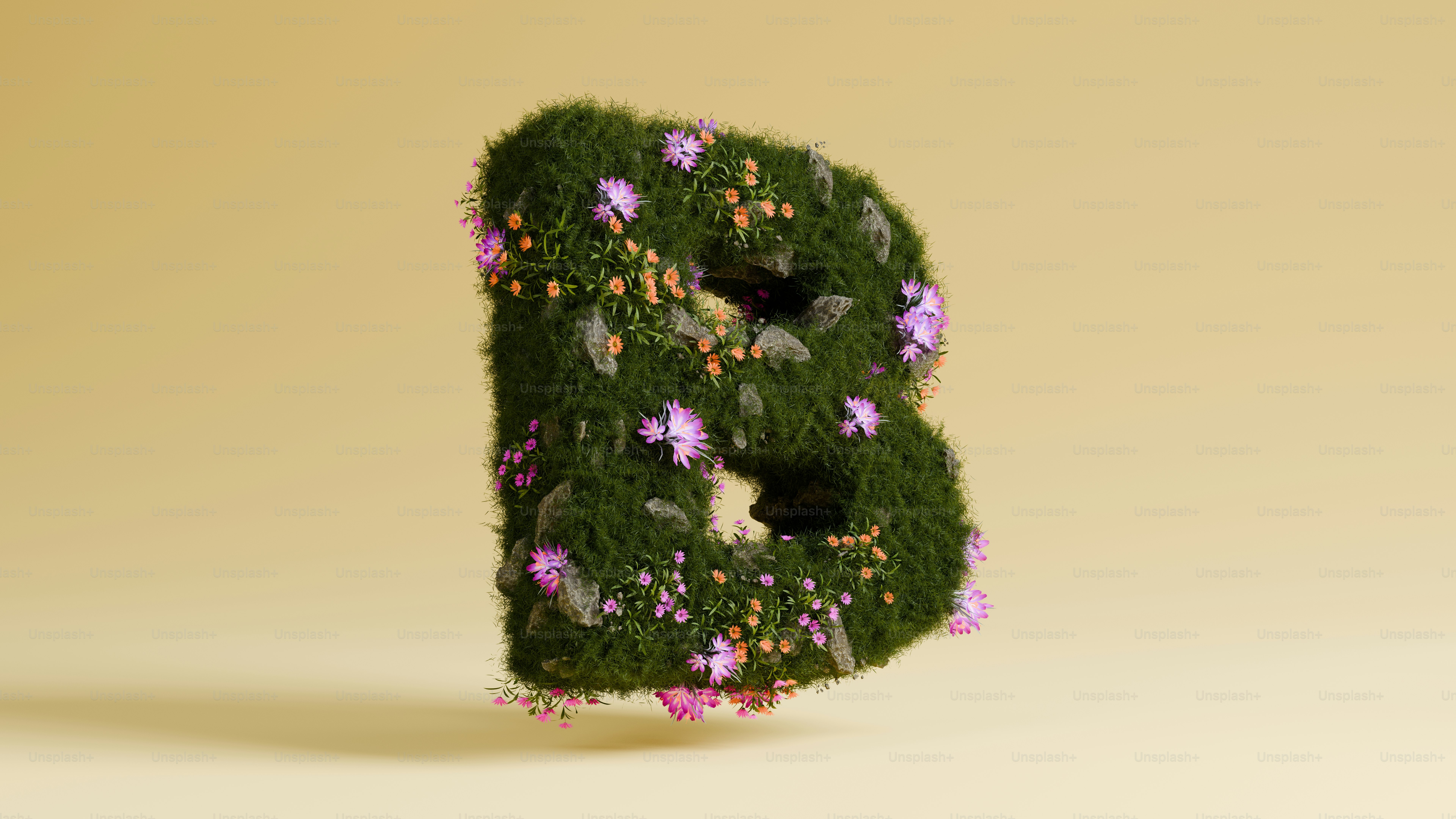 The letter b is covered in flowers and plants.