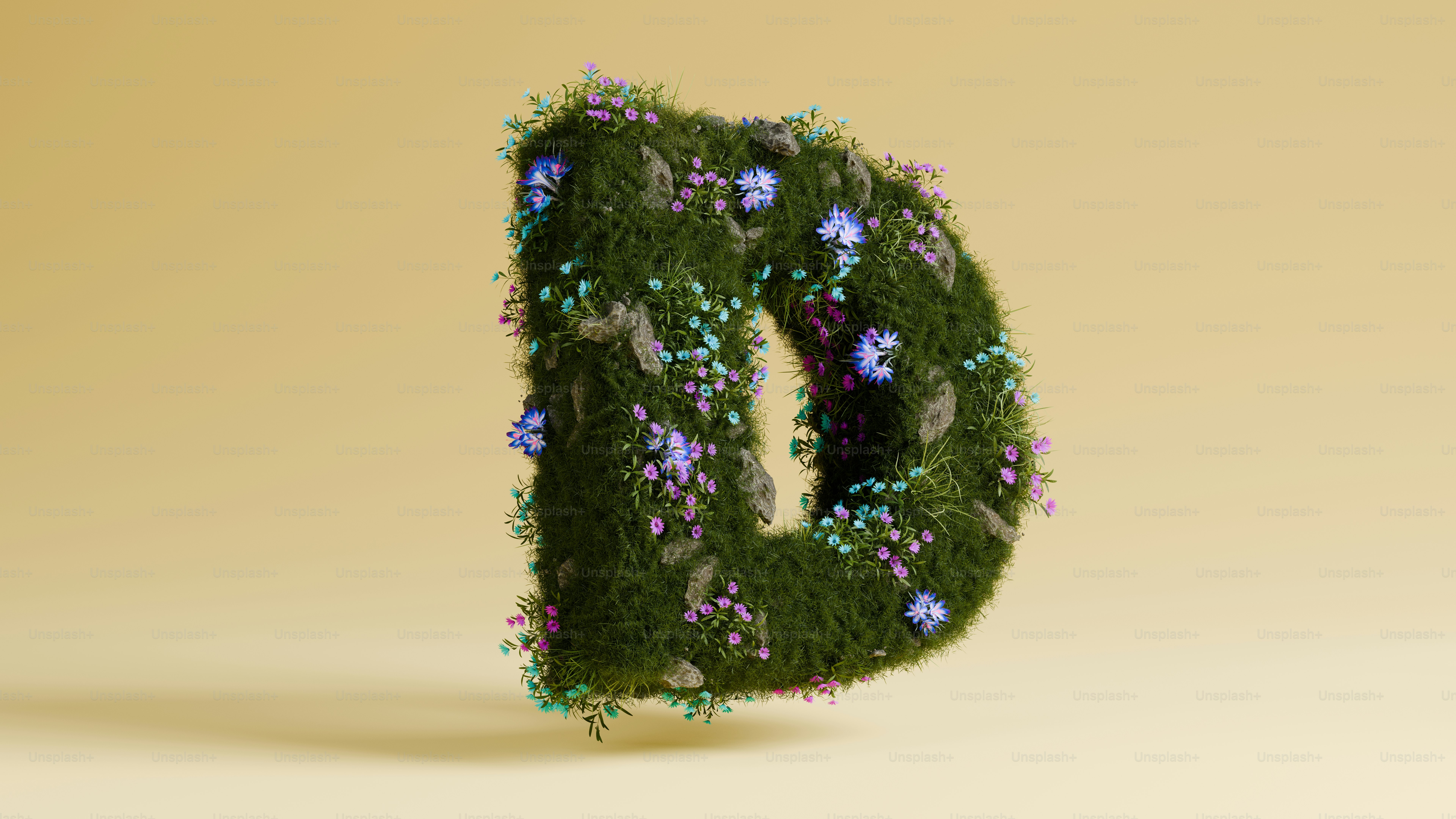 柔らかなベージュの背景に花柄の文字d。