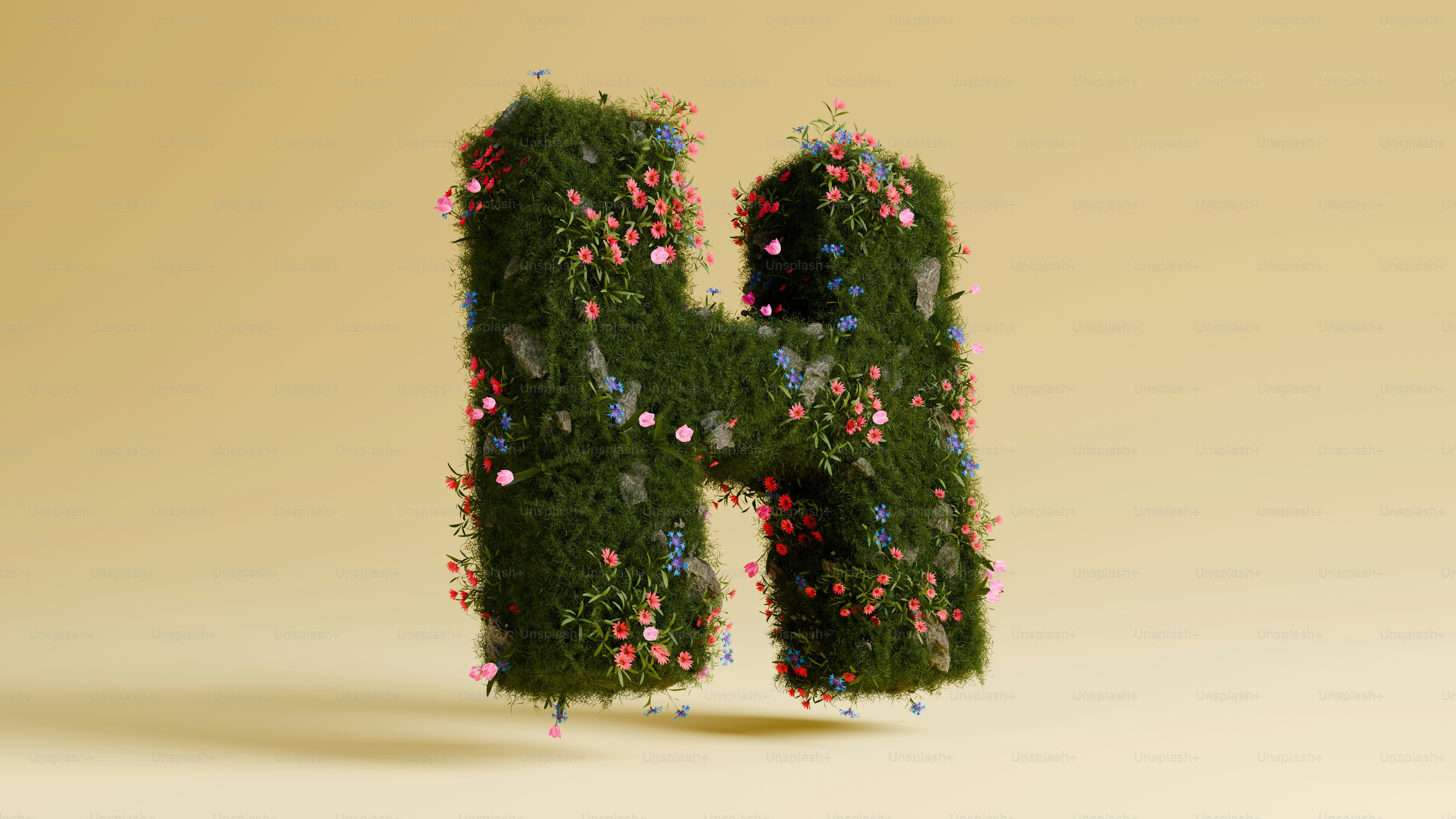 花で覆われた緑色の文字「h」。